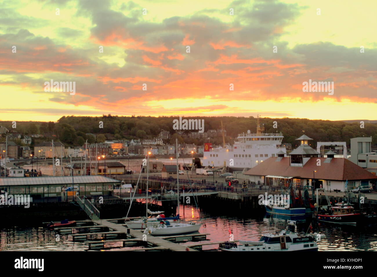 sunset night shot of Rothesay harbour with the ferry argyle docking for the night Caledonian MacBrayne ferry Argyle Rothesay, United Kingdom Stock Photo