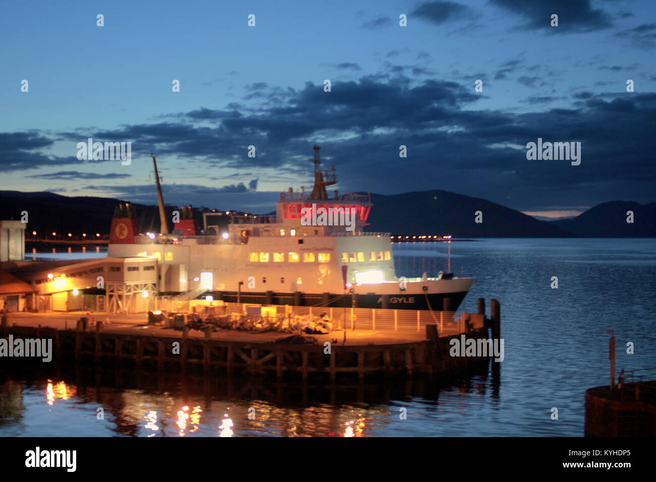 sunset night shot of Rothesay harbour with the ferry argyle docking for the night Caledonian MacBrayne ferry Argyle Rothesay, United Kingdom Stock Photo