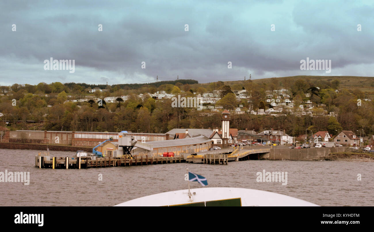 remarkable Wemyss Bay railway station from bow of calmac ferry Argyle  with the Scottish satire flag flapping in the wind ,Wemyss Bay, United Kingdom Stock Photo