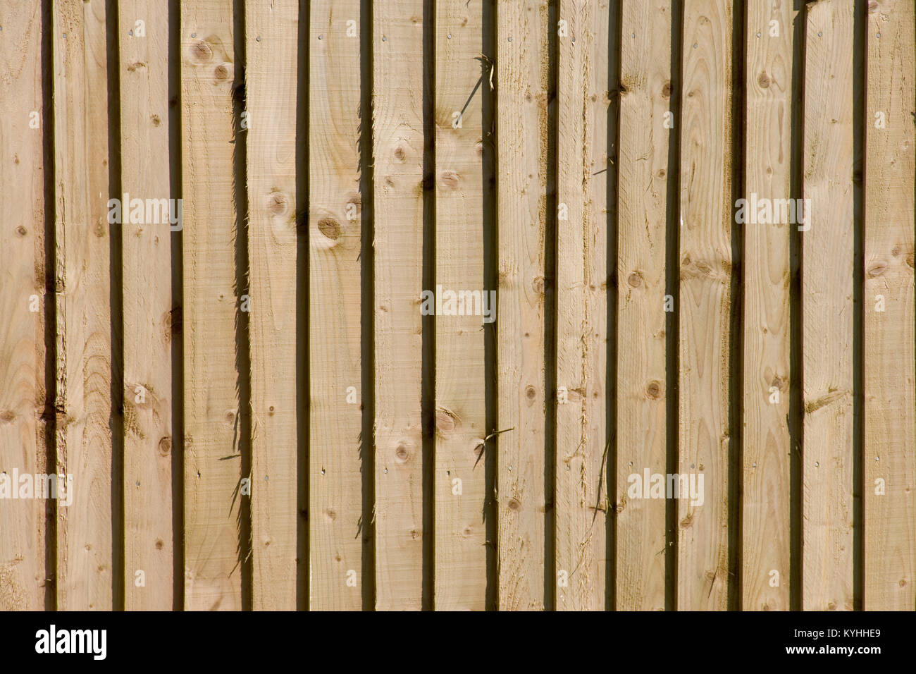 Wooden garden fence in sun background Stock Photo - Alamy