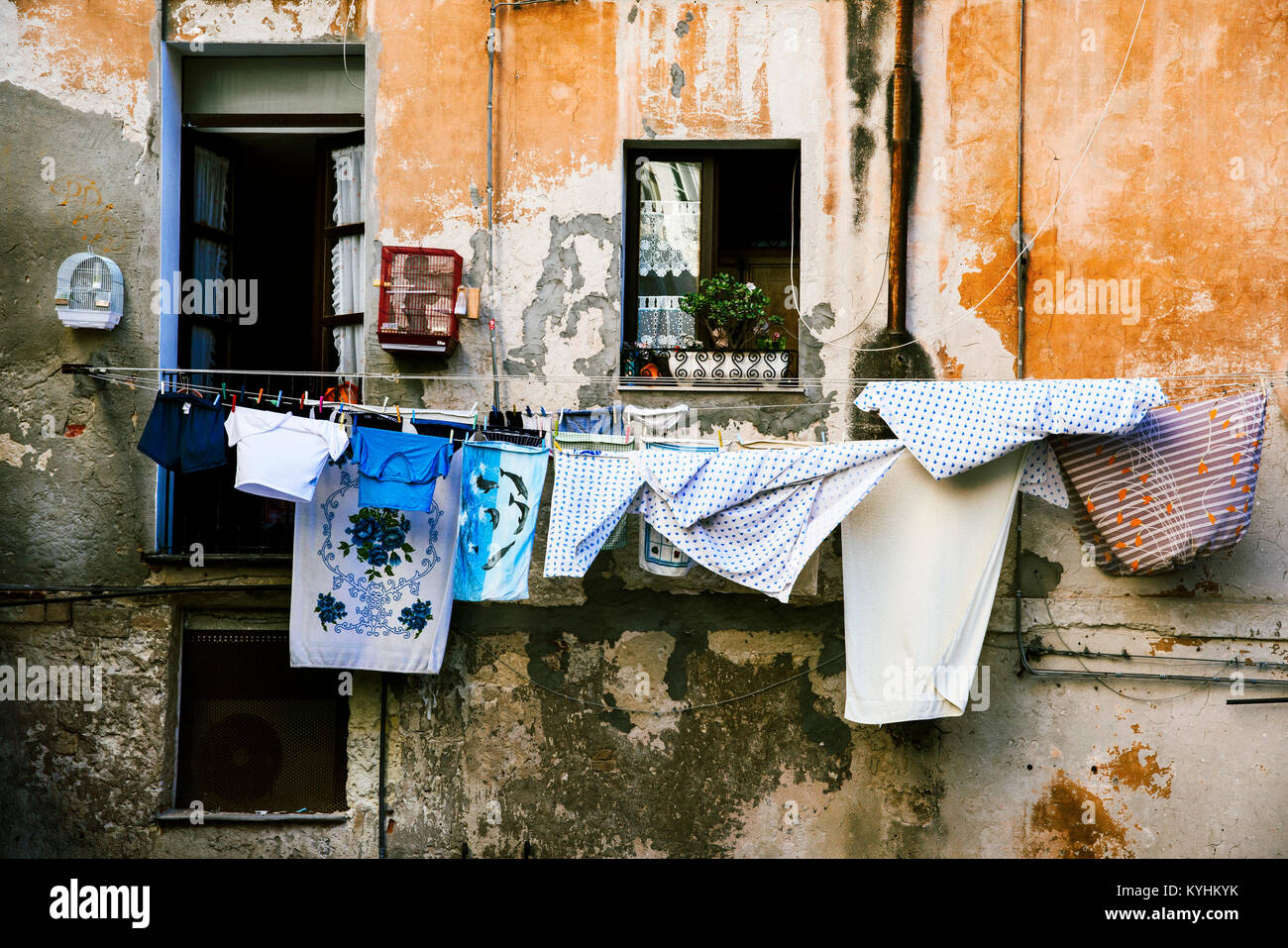 clothes hanging in some clothes lines outdoors in an old building, in