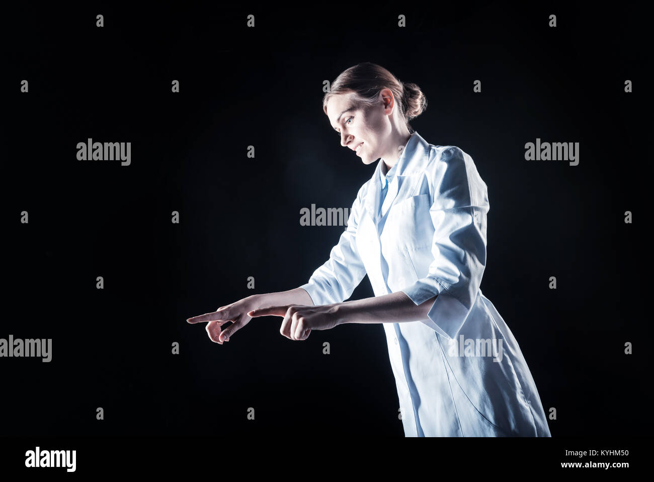 Nice young woman wearing labcoat Stock Photo