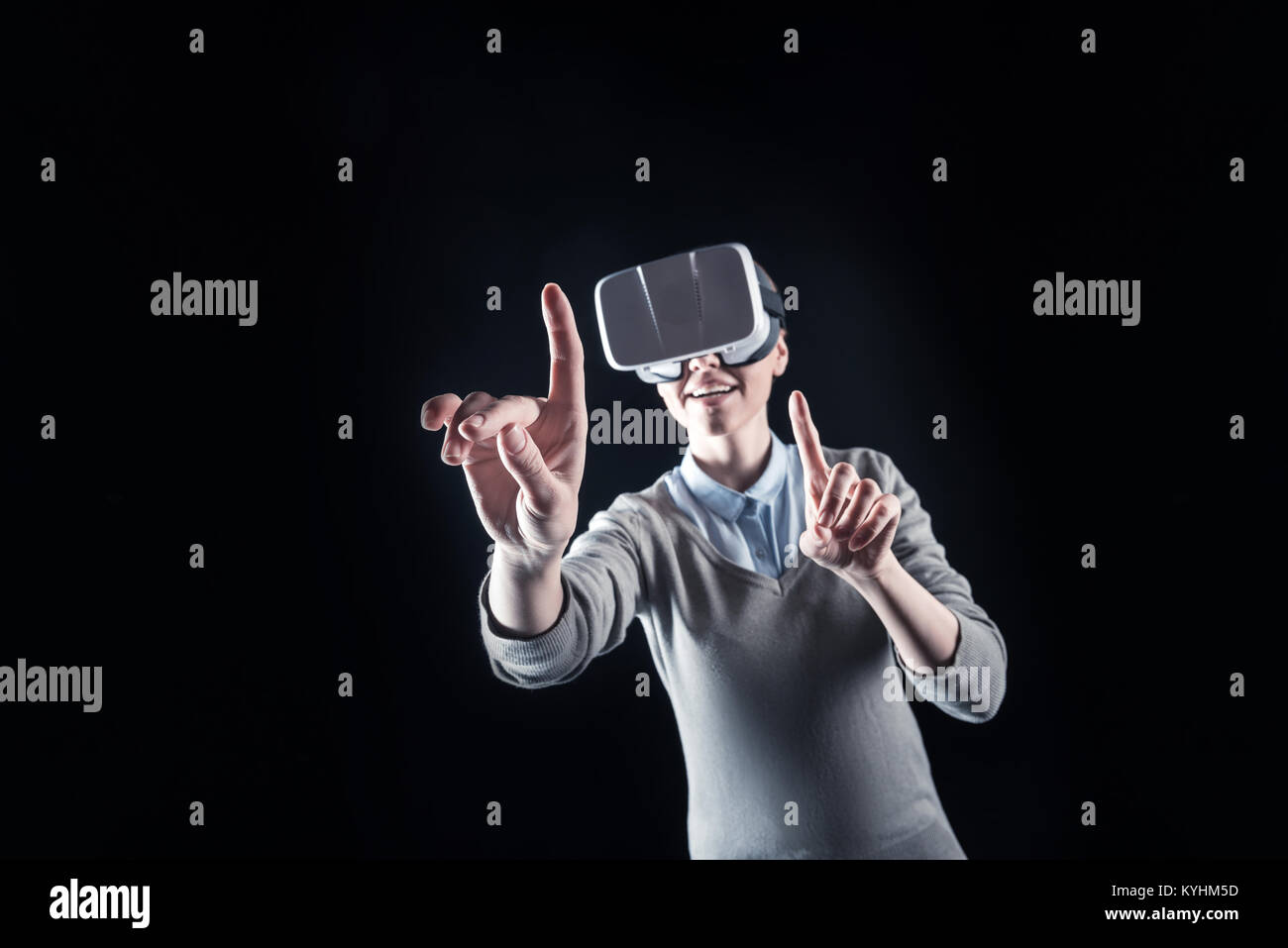Nice happy woman touching the virtual panel Stock Photo - Alamy