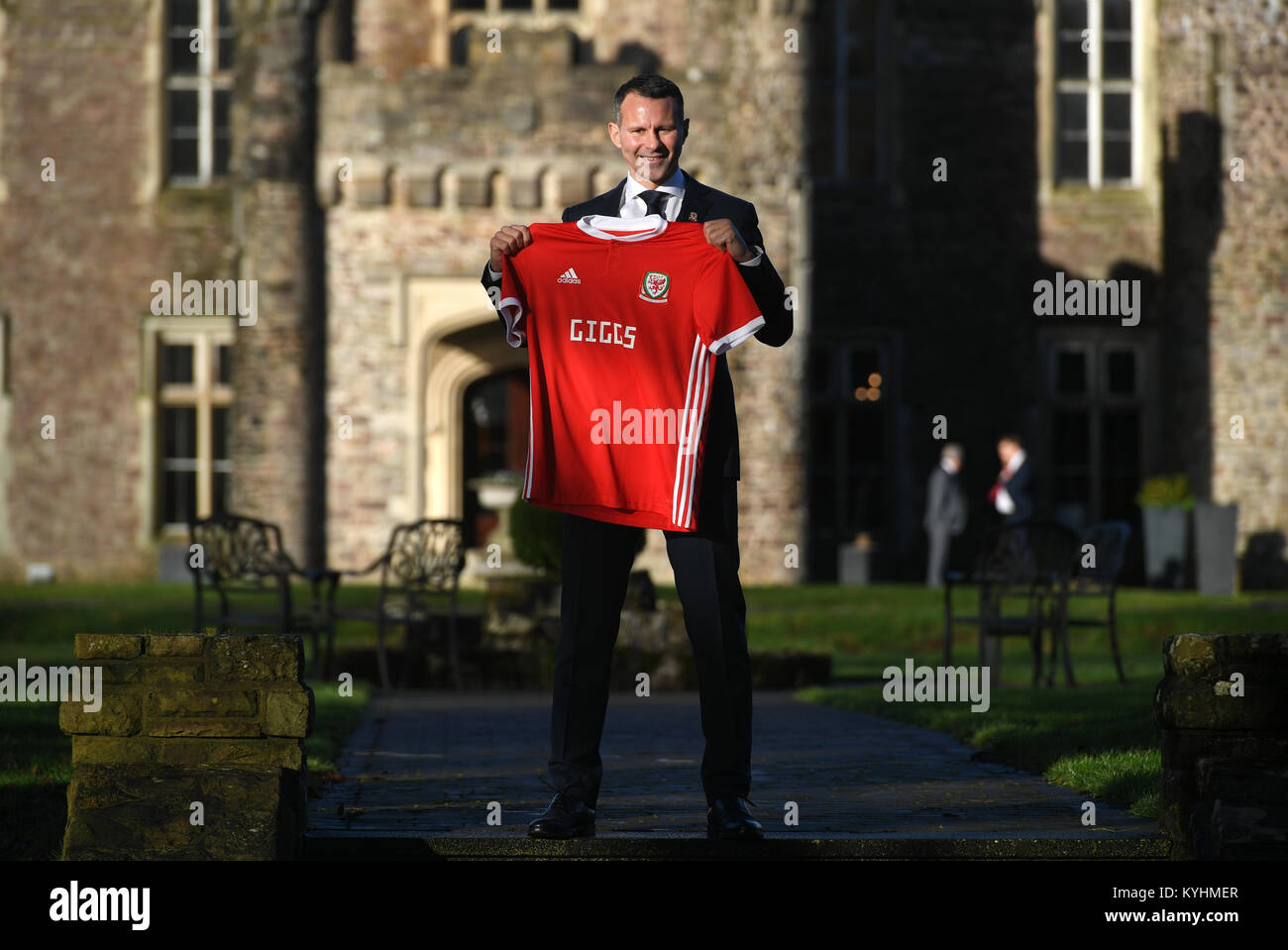 New Wales manager Ryan Giggs poses with a Wales shirt after a press conference at Hensol Caste, Vale Resort, Hensol. Stock Photo