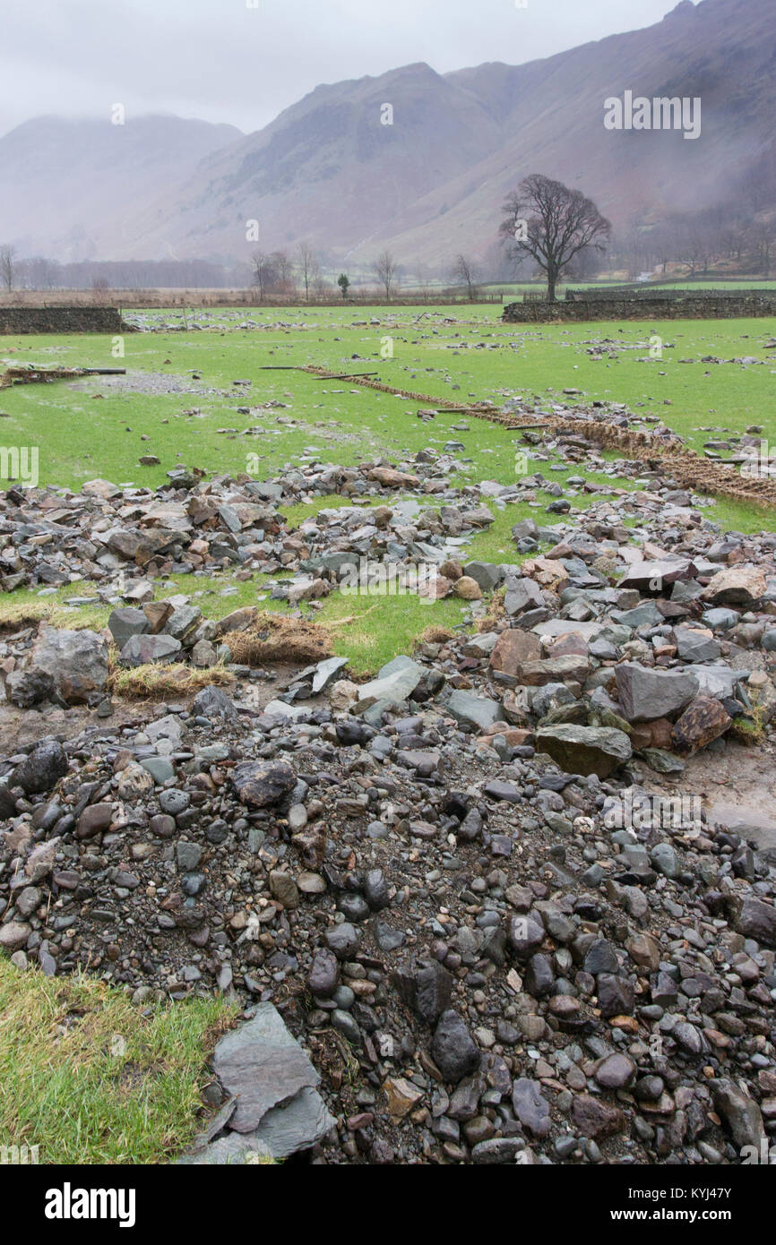 Farmland damaged by flooding, with dry stone walls washed away. Cumbria, UK. Stock Photo