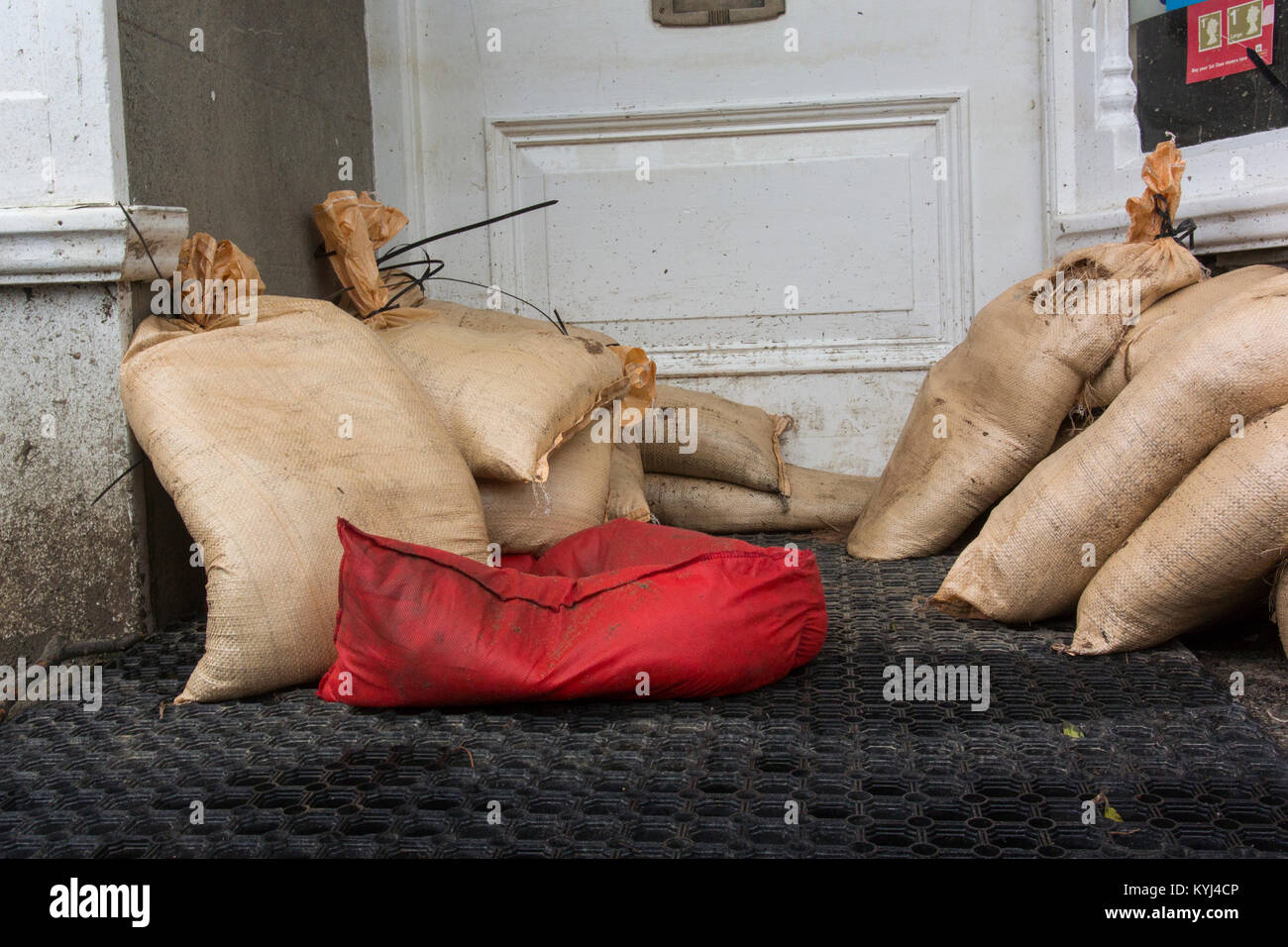 Sandbags outside a doorway to help prevent flooding, Cumbria, UK. Stock Photo