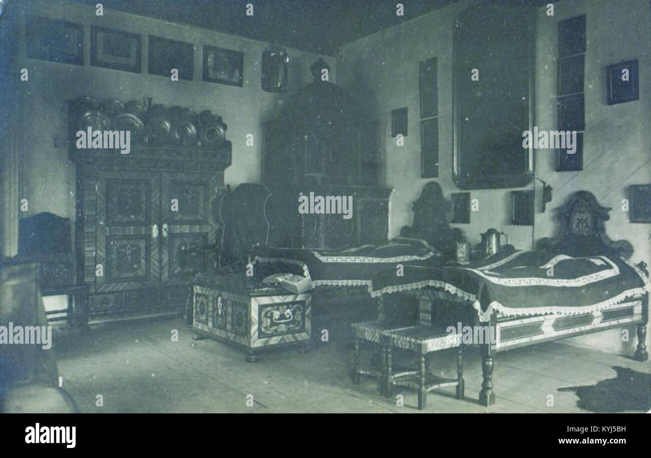 The bedroom of Ivan Tavčar, a Slovenian politician, lawyer, and writer, photographed between 1910 and 1940. The image captures the personal space reflecting the era's interior design and Tavčar's status. Stock Photo