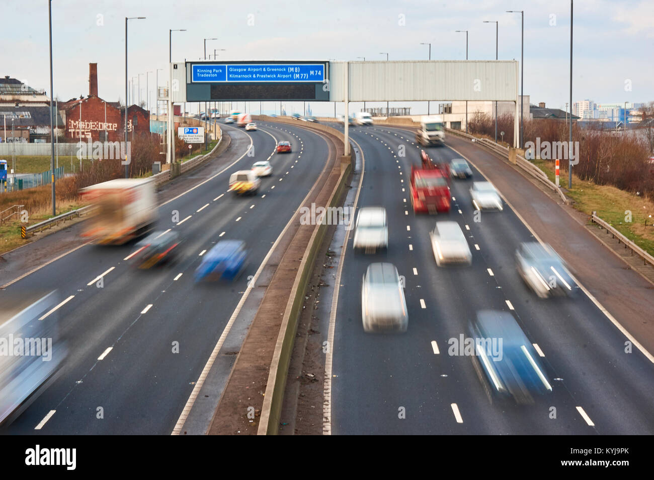 M74 motorway in Glasgow, Scotland, during a weekend traffic with car motion blur. Stock Photo