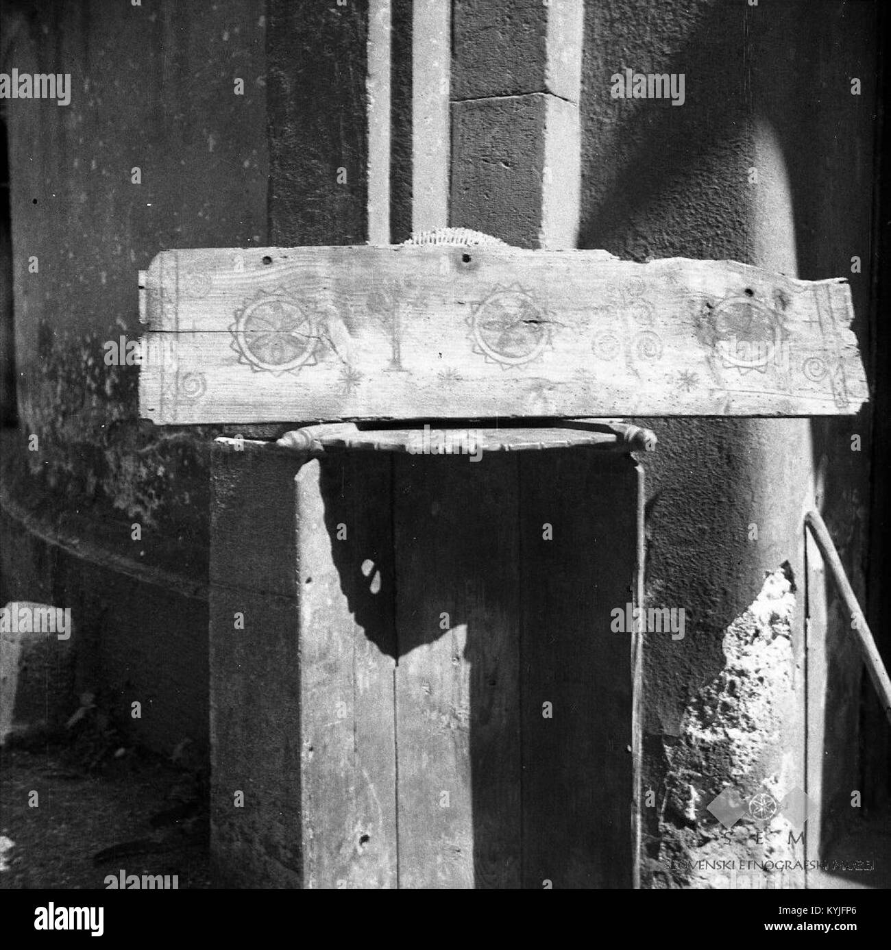 This page from the 1953 edition of 'Stranica briske žibke' showcases Slovenian cultural heritage, featuring decorative elements like the ornamented cradle (zibelka), a traditional Slovene object. Stock Photo