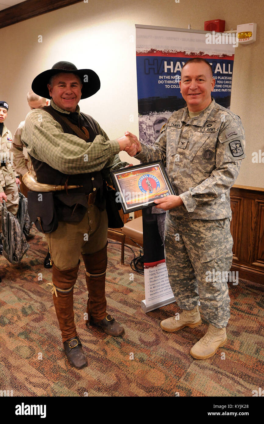 Col. Craig Ekman, Senior National Guard Advisor at Fort Knox, presents Phillip Williams a certificate of appreciation during a birthday celebration of the Guard's 376th Birthday at Fort Knox, Ky., Dec. 13, 2012. (KYNG photo by Sgt. Scott Raymond) Stock Photo