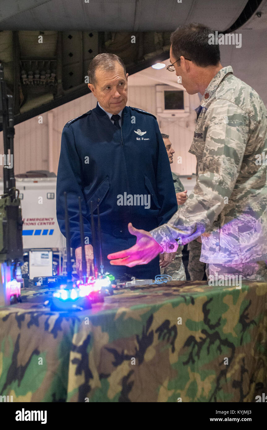 Maj. Sean McLane, director of operations for the Kentucky Air National Guard’s 123rd Special Tactics Squadron, demonstrates a variety of special operations equipment to General William M. Fraser III, commander of U.S. Transportation Command, during a tour of the 123rd Airlift Wing in Louisville, Ky., on March 12, 2013. The gear is used to establish operations at austere landing zones. (U.S. Air Force Photo by Master Sgt. Phil Speck) Stock Photo