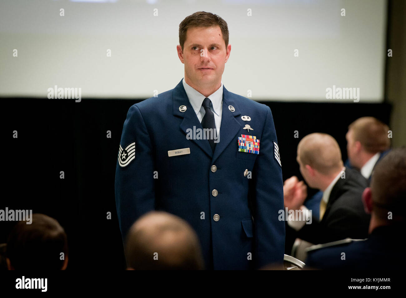 Technical Sgt. Harley Bobay, a combat controller with the 123rd Special Tactics Squadron, stands at attention during the Outstanding Airman and Soldier of the Year Banquet in Louisville, Ky., on March 16, 2013. Bobay is the Kentucky Air National Guard’s Outstanding Non-Commissioned Officer of the Year for 2013. (U.S. Air Force photo by Staff Sgt. Maxwell Rechel) Stock Photo