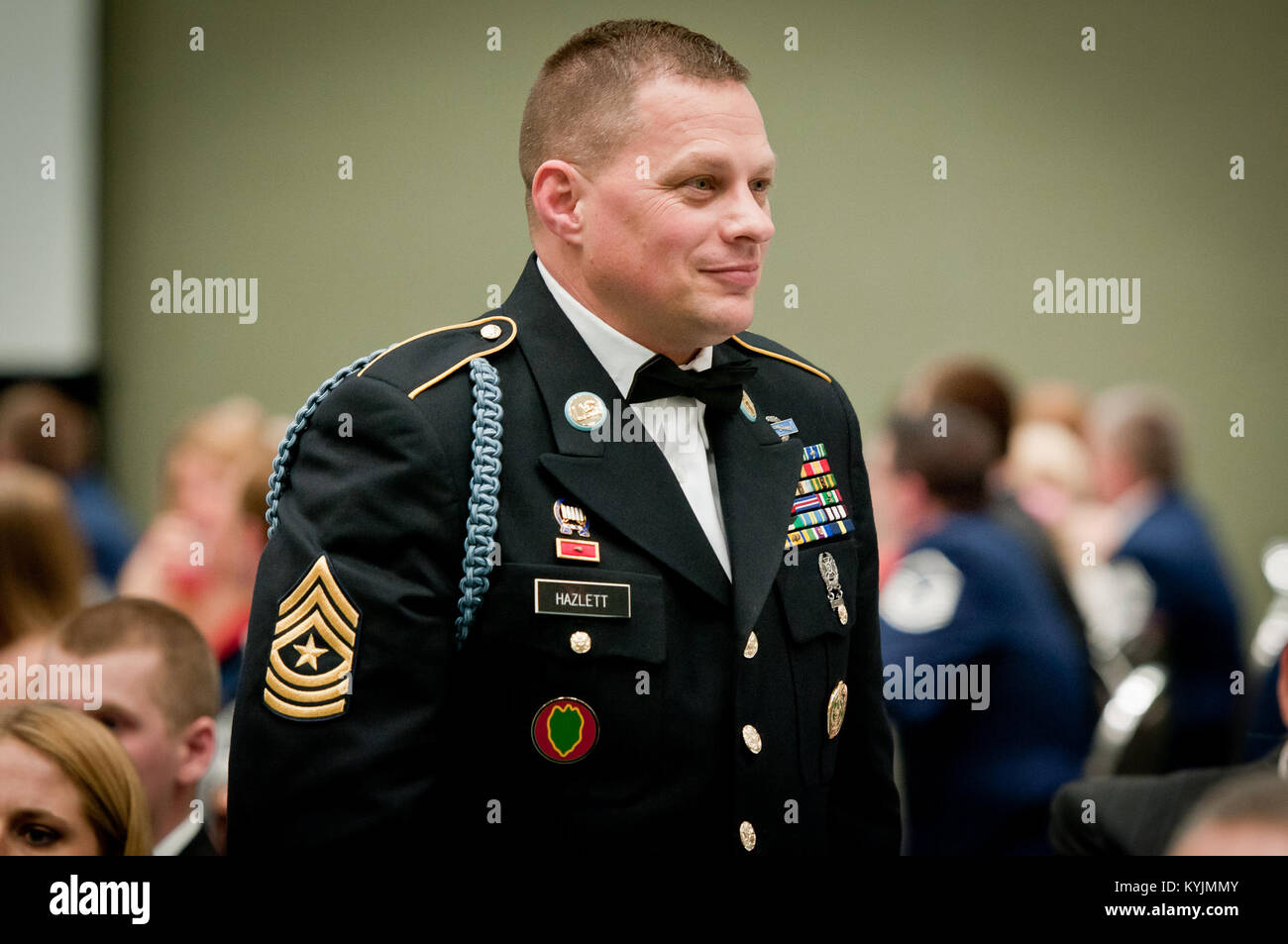 Master Sgt. John Hazlett, operations sergeant major for the Kentucky Army Guard's 149th Brigade, stands at attention during the Outstanding Airman and Soldier of the Year Banquet in Louisville, Ky., on March 16, 2013. Hazlett is the Kentucky Army National Guard’s Outstanding Senior Non-Commissioned Officer of the Year for 2013. (U.S. Air Force photo by Staff Sgt. Maxwell Rechel) Stock Photo
