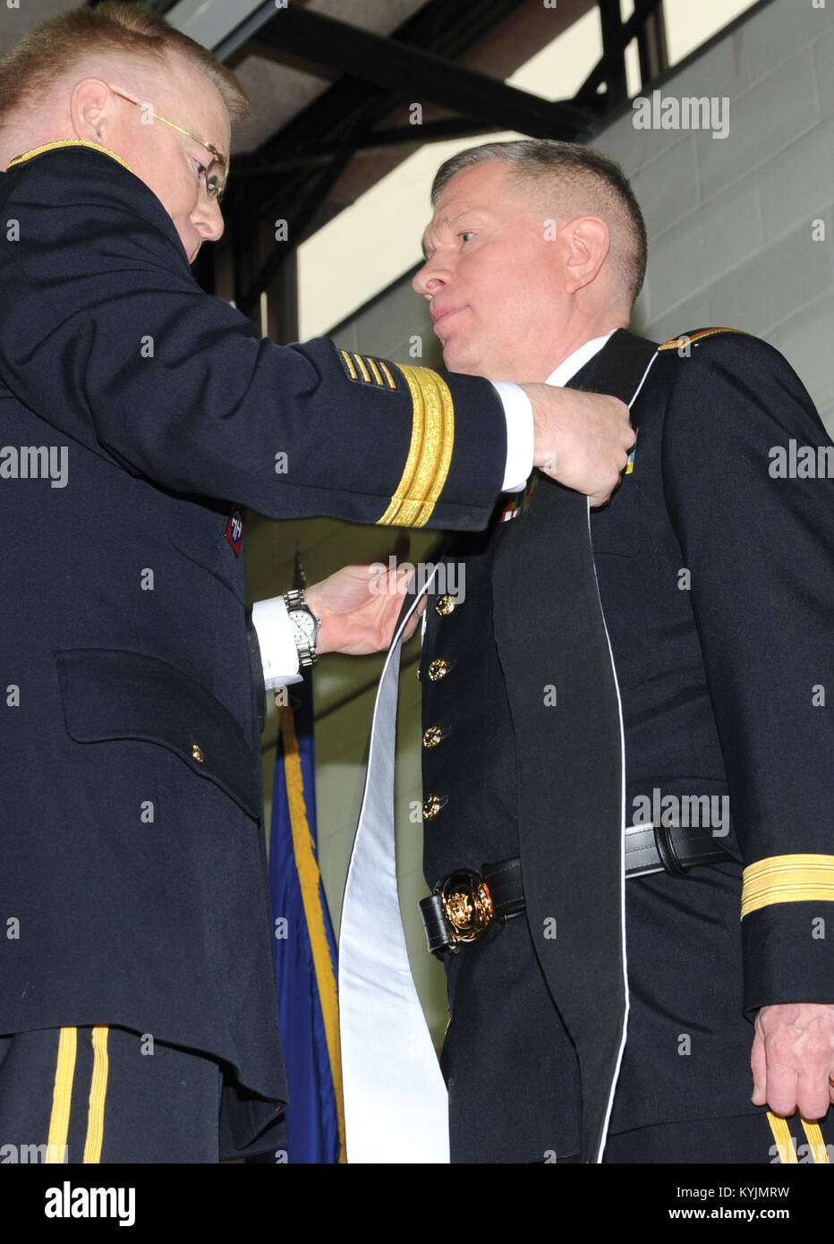 Army Chief of Chaplains Maj. Gen. Donald L. Rutherford, presents Army Brig. Gen. David. E. Graetz, assistant to the Army chief of chaplains as the National Guard liaison, with a stole during his promotion ceremony at the Maj. Gen. Billy G.  Wellman Armory at Boone National Guard Center in Frankfort, Ky., Jan. 11, 2015.The stole formally symbolizes the responsibilities assumed with Graetz’s promotion. Stock Photo