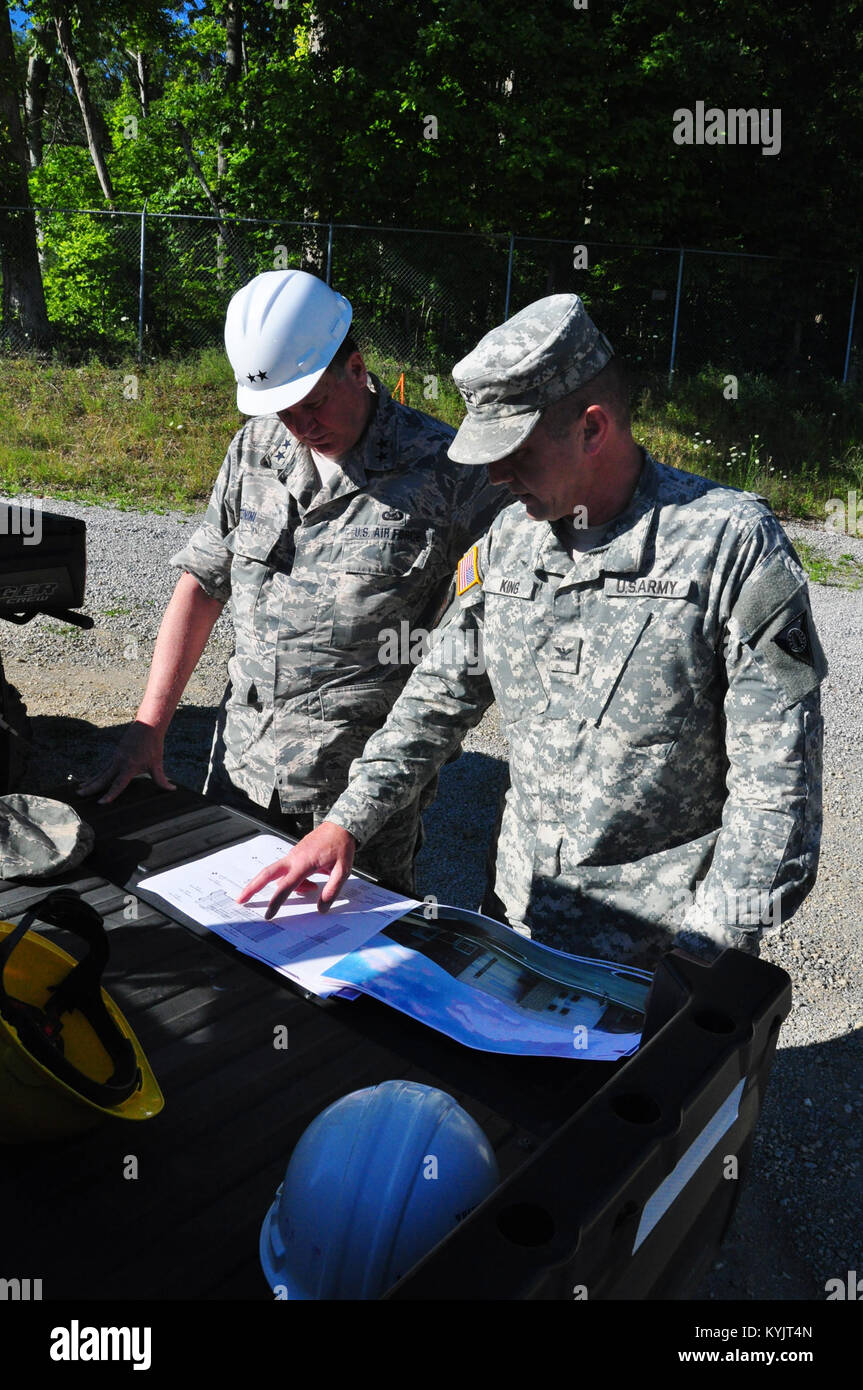 Maj. Gen. Edward Tonini being briefed on the progress of the new Army Aviation Support Facility by Col. Steven T. King prior to a walk through of the construction site on July 16, 2014. (U.S. Army National Guard photo by Maj. David Page) Stock Photo