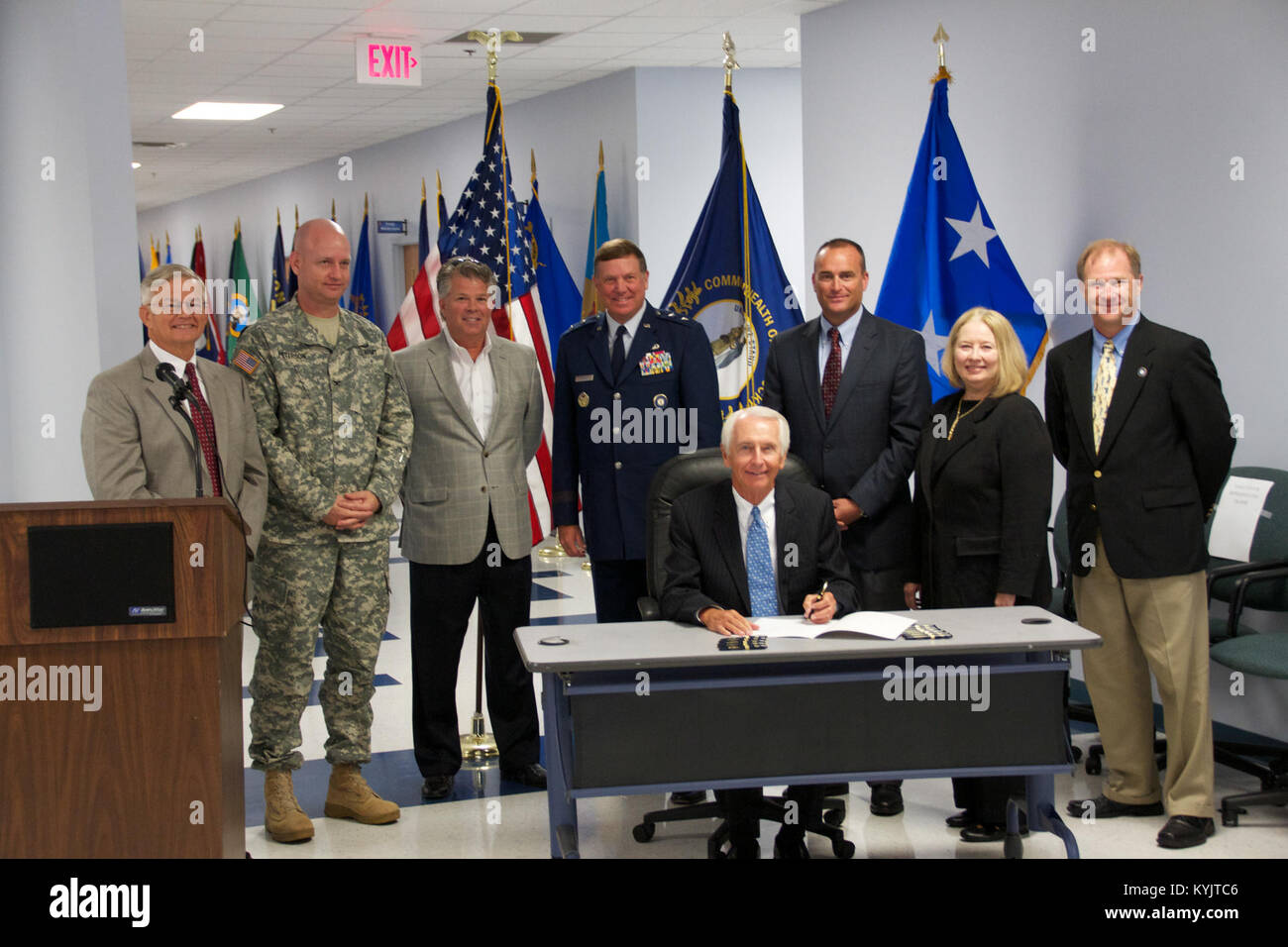 Governor Steve Beshear ceremoniously signs House Bill 318, co-sponsored by State Representative Ruth Ann Palumbo and State Senator R.J. Palmer at Bluegrass Station in Lexington, Ky., Sept. 3. The bill will foster economic development by providing high wage jobs and supporting the military throughout the commonwealth according to Rep. Palumbo. (U.S. Army National Guard photo by Maj. Stephen Martin, Kentucky National Guard Public Affairs) Stock Photo