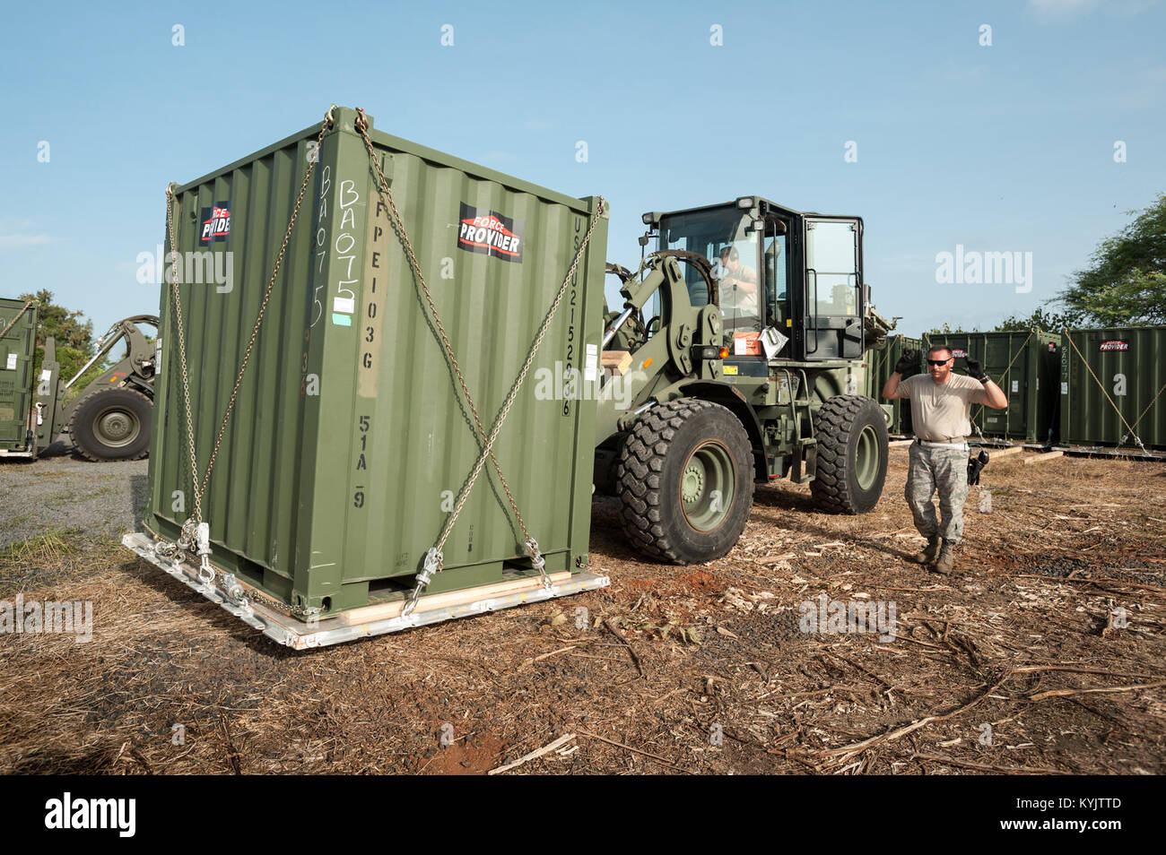 U.S. Air Force Staff Sgt. Anthony Hayden, an aerial porter from the Kentucky Air National Guard’s 123rd Contingency Response Group, directs the movement of cargo outside the Joint Operations Center at Léopold Sédar Senghor International Airport in Dakar, Senegal, Oct. 24, 2014. Hayden and more than 70 other Kentucky Air Guardsmen are operating an Aerial Port of Debarkation in Senegal to funnel humanitarian supplies and military support into West Africa as part of Operation United Assistance, the U.S. Agency for International Development-led, whole-of-government effort to contain the Ebola viru Stock Photo