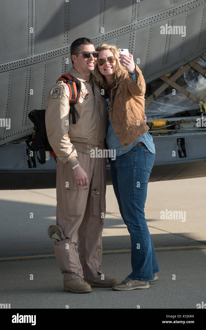 Capt. Brice Hayden, a C-130 navigator in the Georgia Air National Guard's 165th Airlift Wing, and his wife, Kristin Hayden, take a selfie at the Kentucky Air National Guard Base in Louisville, Ky., April 24, 2015, prior to his deployment to an undisclosed air base in the Persian Gulf region. Hayden's unit has joined forces with the Kentucky Air Guard's 123rd Airlift Wing to flying airlift missions throughout the U.S. Central Command Area of Responsibility in support of Operation Freedom's Sentinel, which provides military training and counterterrorism capabilities in Afghanistan. (U.S. Air Nat Stock Photo