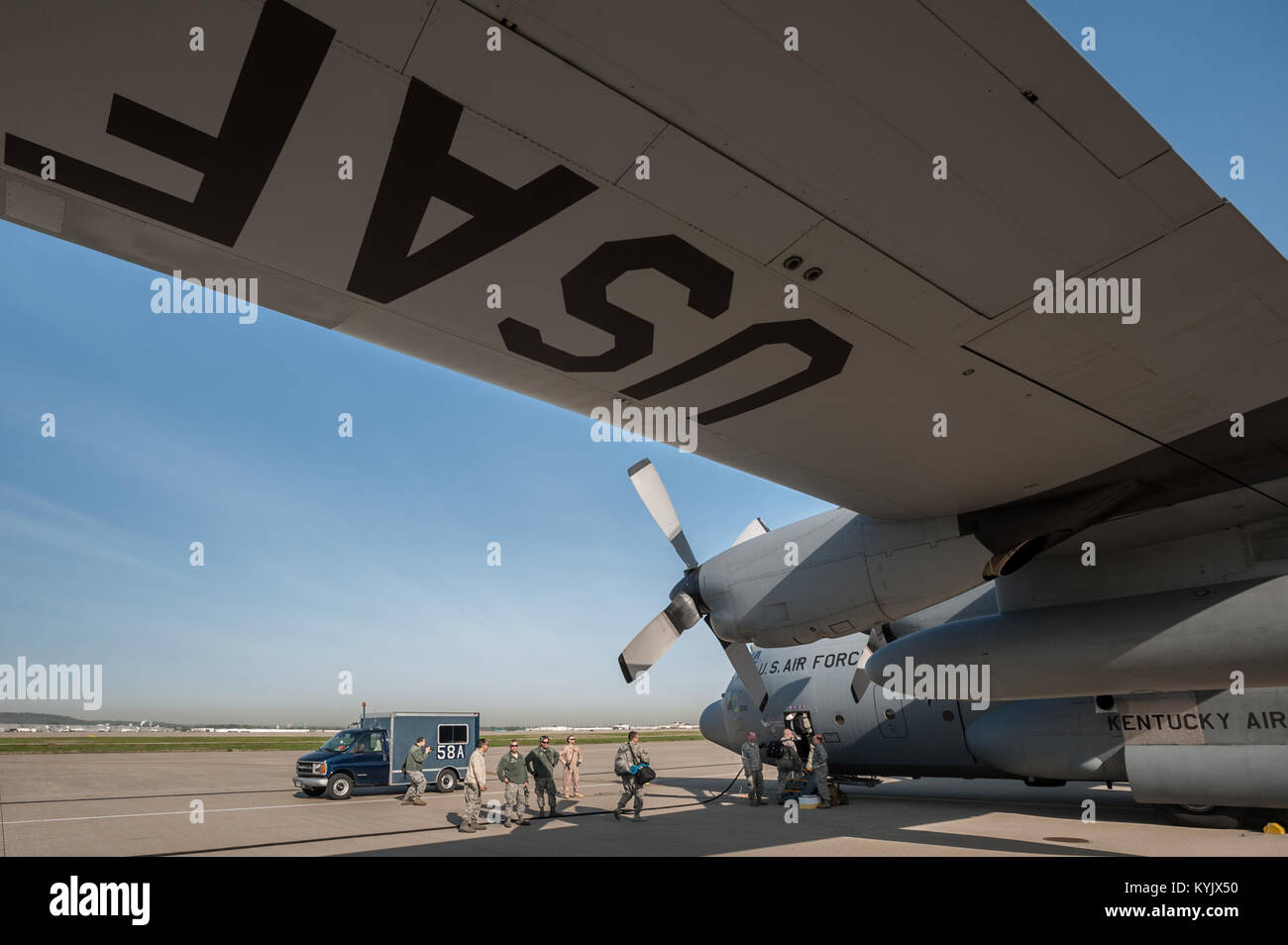 Airmen from the 123rd Airlift Wing board a C-130 Hercules aircraft at the Kentucky Air National Guard Base in Louisville, Ky., April 24, 2015, prior to their departure for deployment to an undisclosed air base in the Persian Gulf region. The Air Guardsmen will be flying airlift missions throughout the U.S. Central Command Area of Responsibility in support of Operation Freedom's Sentinel, which provides military training and counterterrorism capabilities in Afghanistan. (U.S. Air National Guard photo by Maj. Dale Greer) Stock Photo