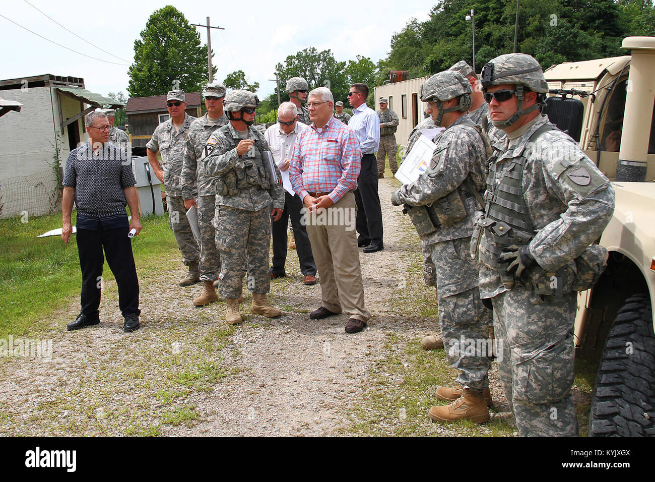 Retired Army Gen. Carter Ham and Members of the National Commission on the Future of the Army visit with Kentucky Guardsmen during a stop in Camp Atterbury, Ind., July 20, 2015. (U.S. Army National Guard photo by Staff Sgt. Scott Raymond) Stock Photo