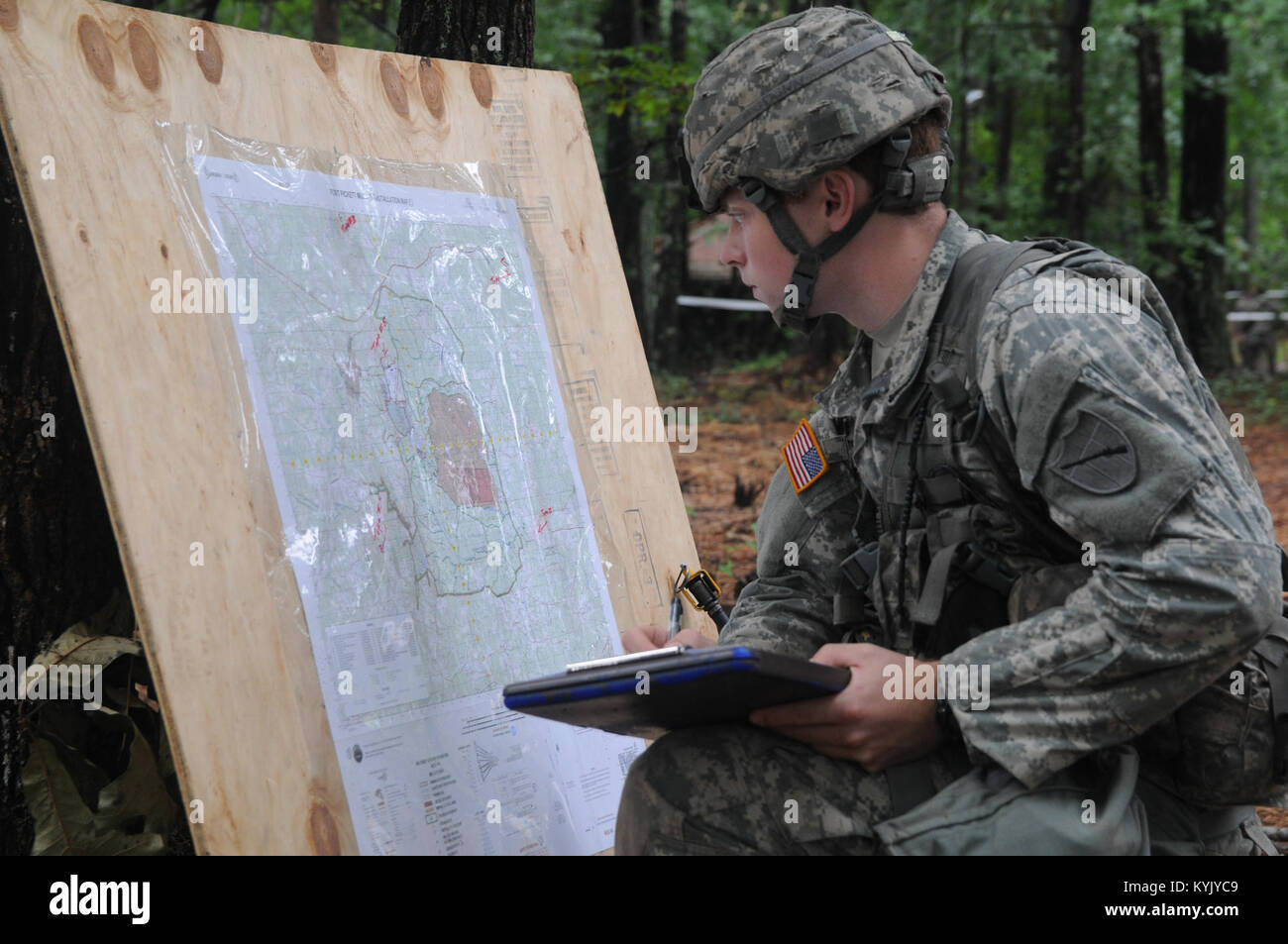 Spc. Adam Dunn, an infantryman attached to the 1st Battalion 149th Infantry Regiment , Kentucky National Guard, identifies topographical symbols on a map during testing for the Expert Infantry Badge Aug. 5 through Aug. 10 at Fort Pickett, Va. Dunn was one of three Kentucky Guardsmen to earn the EIB. (U.S. Army National Guard photo by Staff Sgt. Lerone Simmons) Stock Photo