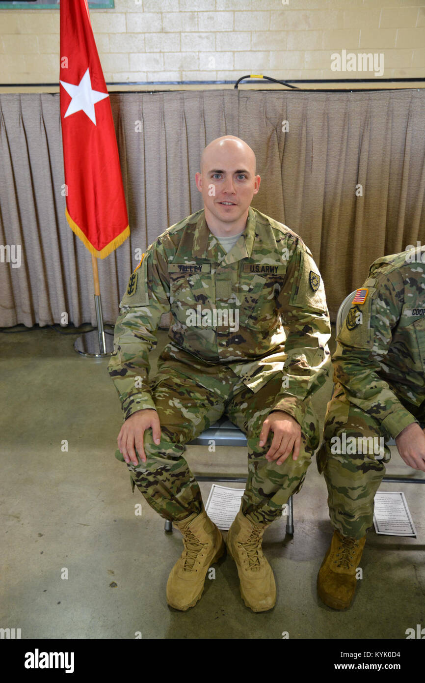 OC Nicolas Tilley prepares to take his oath of office and receive his