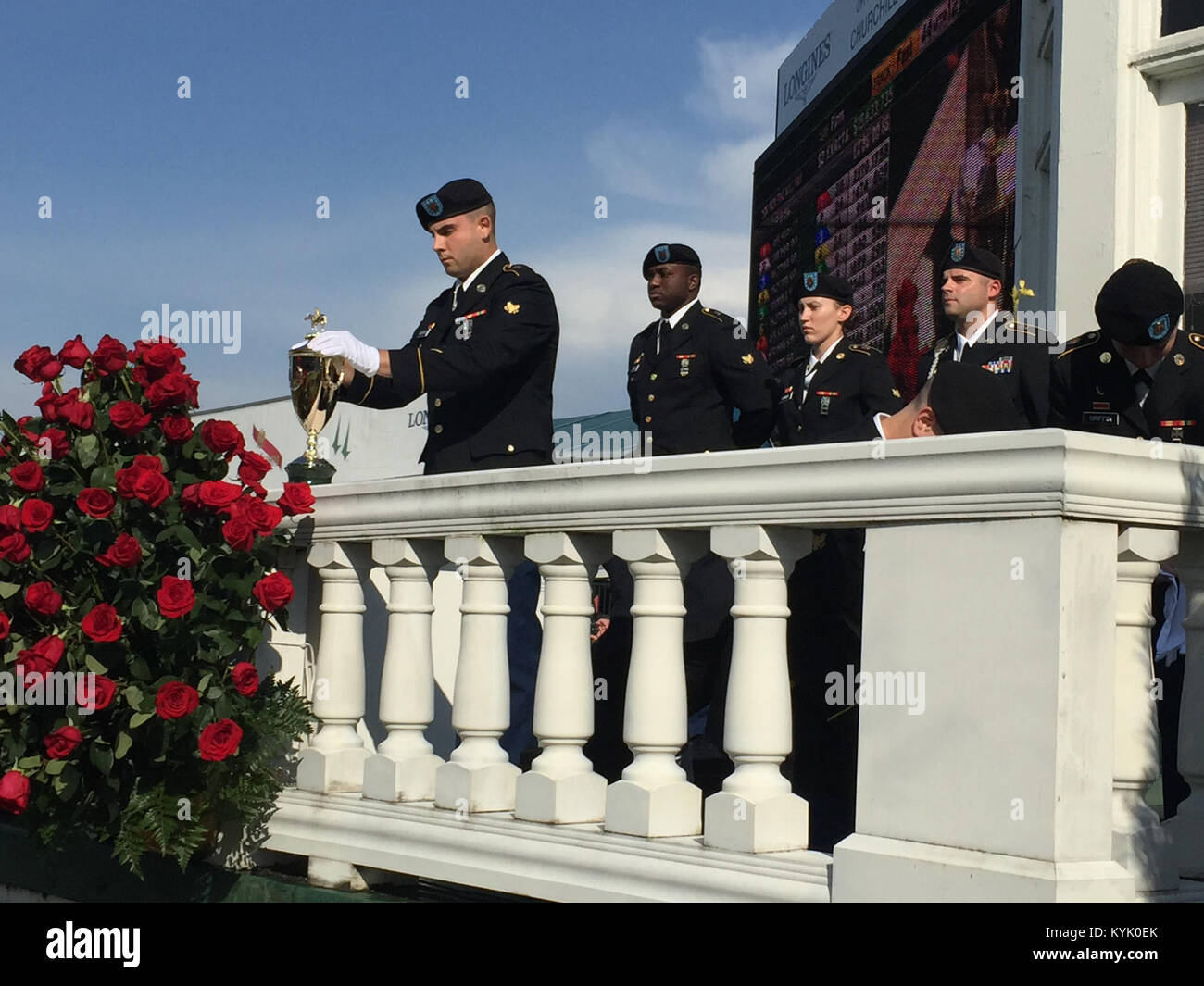 Members of the Trophy Detail place the Kentucky Derby Trophy in the