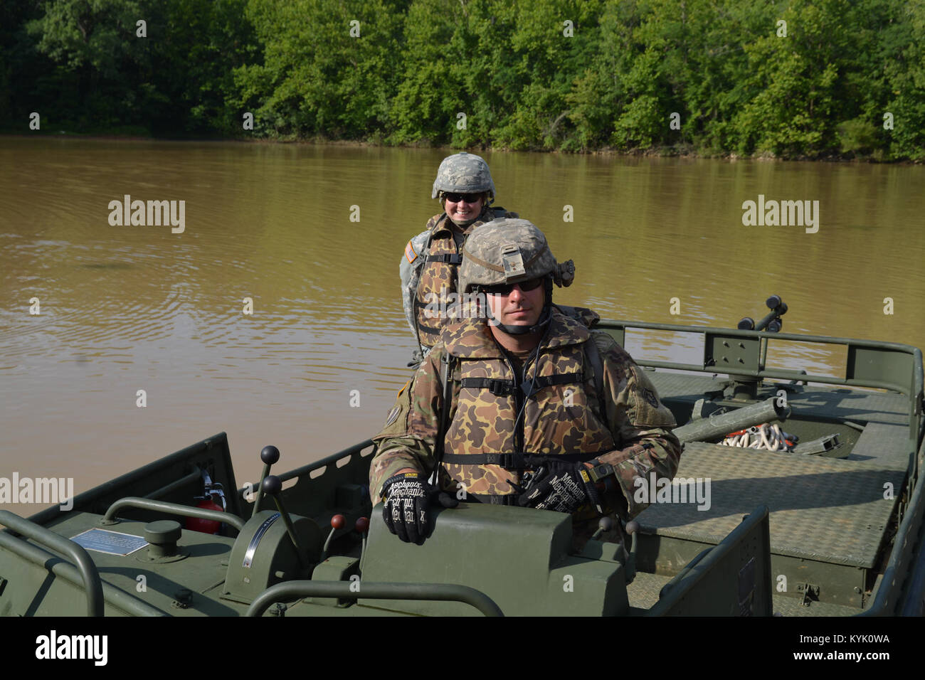 SSG David Fox of the 2061st Multi Role Bridge Company pilots a MK2 boat as part of annual training at Fort Knox Kentucky on 15 Jul 2016. (Kentucky National Guard photo by Walt Leaumont) Stock Photo