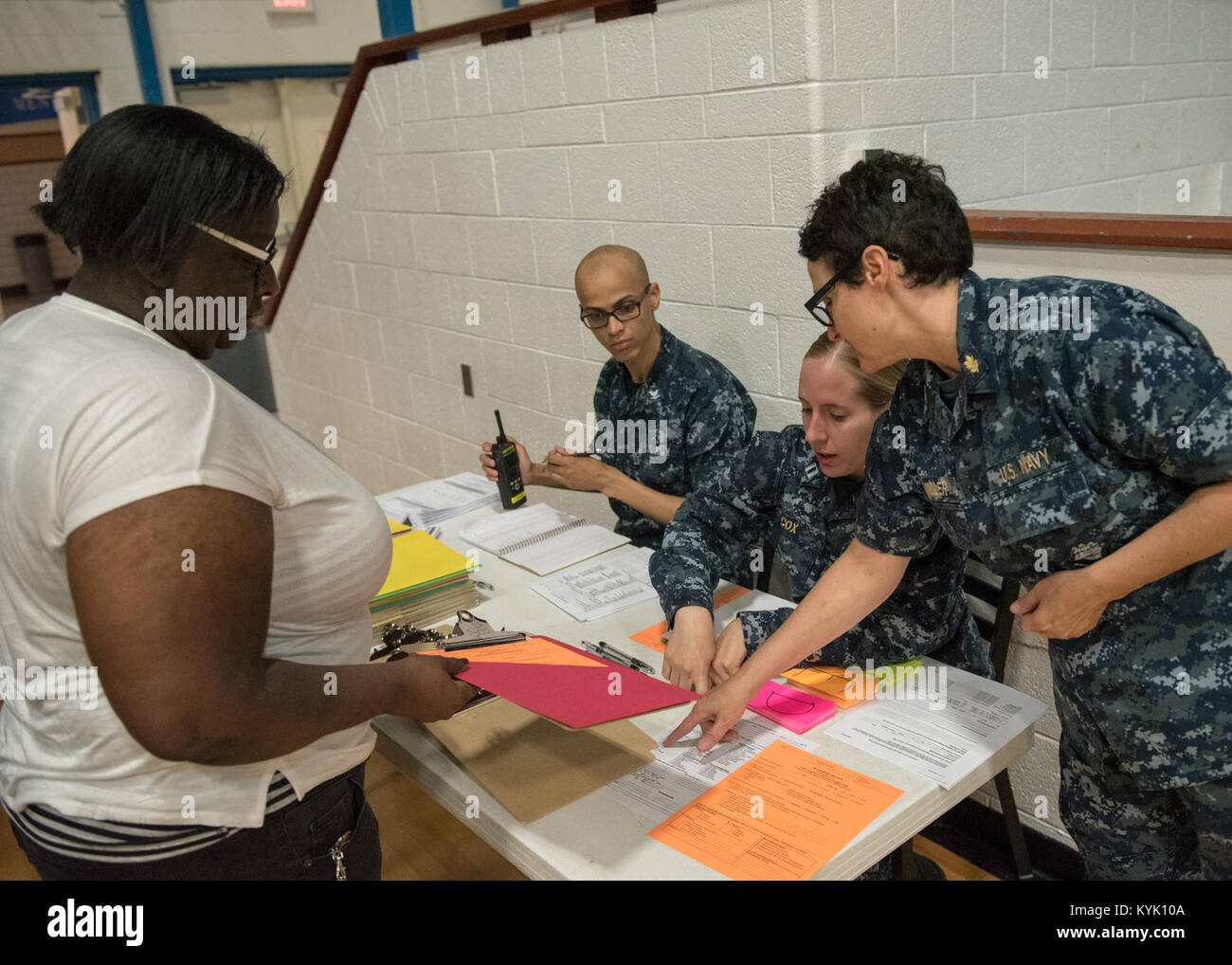 U.S. Navy Sailors assist a patient register for medical care at Paducah Tilghman High School in Paducah, Ky., July 18, 2016, during the Bluegrass Medical Innovative Readiness Training. During this training several Air National Guard units including the Kentucky Air National Guard, U.S. Navy Reserves, U.S. Army National Guard and Delta Regional Authority will offer medical and dental care at no cost to residents in three Western Kentucky locations from July 18 to 27. (U.S. Air National Guard photo by Master Sgt. Phil Speck) Stock Photo