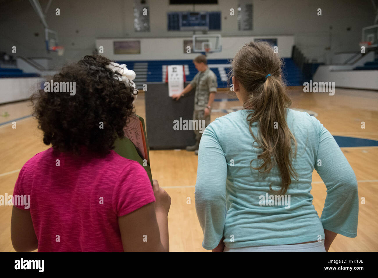 Two children participate in a vision test at Paducah Tilghman High School in Paducah, Ky., July 18, 2016, during the Bluegrass Medical Innovative Readiness Training. During this training several Air National Guard units including the Kentucky Air National Guard, U.S. Navy Reserves, U.S. Army National Guard and Delta Regional Authority will offer medical and dental care at no cost to residents in three Western Kentucky locations from July 18 to 27. (U.S. Air National Guard photo by Master Sgt. Phil Speck) Stock Photo