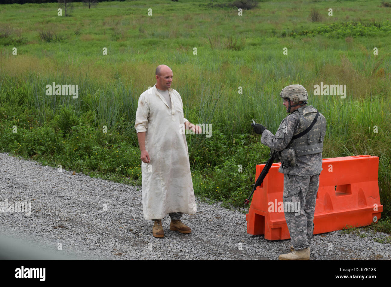 Master Sgt. Richard Harris of the 149th Military Engagement Team conducts entry control point