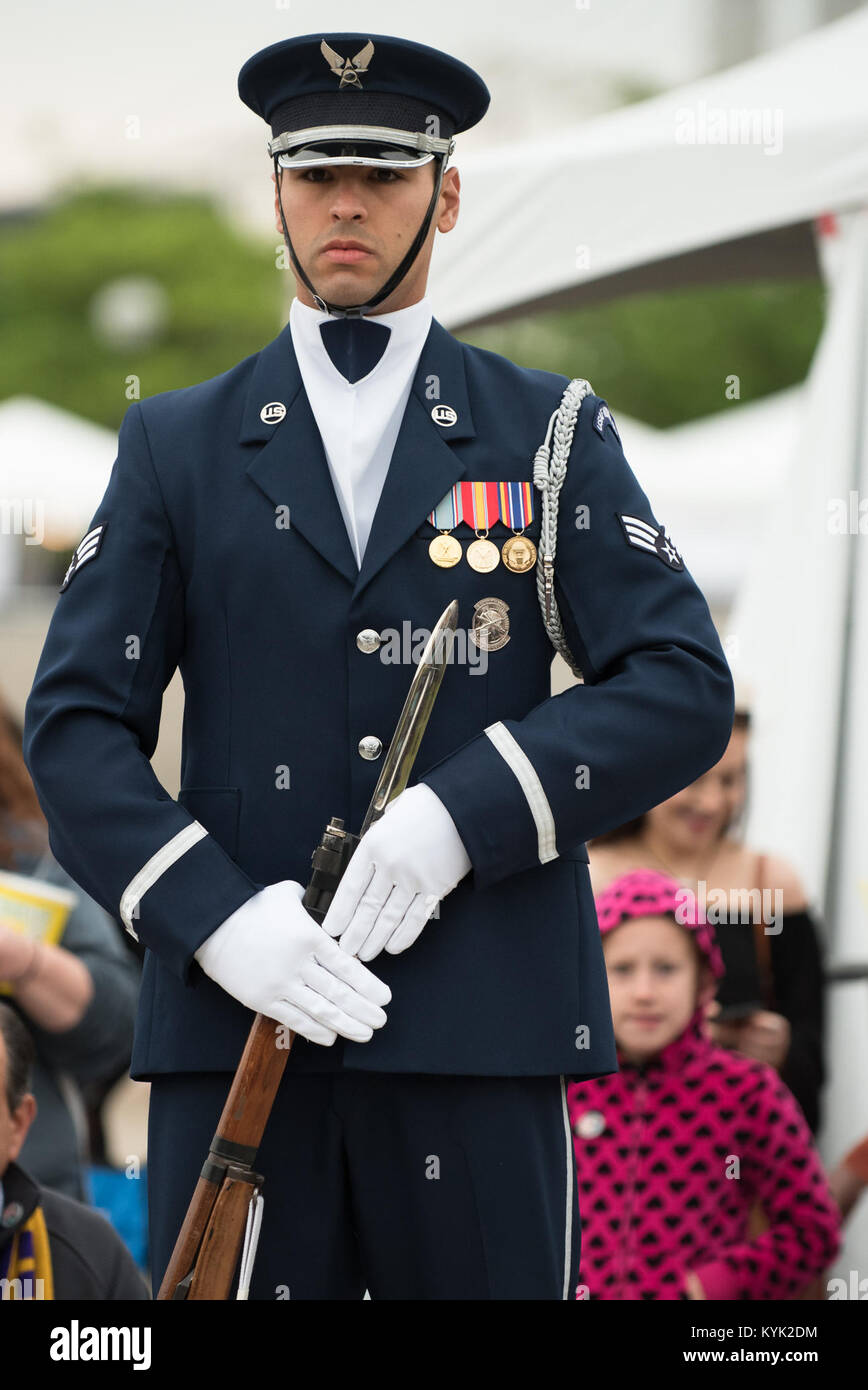 A member of the U.S. Air Force Honor Guard prepares to execute a precision rifle drill before an appreciative crowd at Waterfront Park in downtown Louisville, Ky., May 3, 2017, during the Kentucky Derby Festival. The Airman, from Joint Base Anacostia-Bolling in Washington, D.C., is part of a team that strives to represent the Air Force Core Values of integrity, service and excellence through precise drill movements, immaculate appearance and extreme attention to detail. (U.S. Air National Guard photo by Lt. Col. Dale Greer) Stock Photo