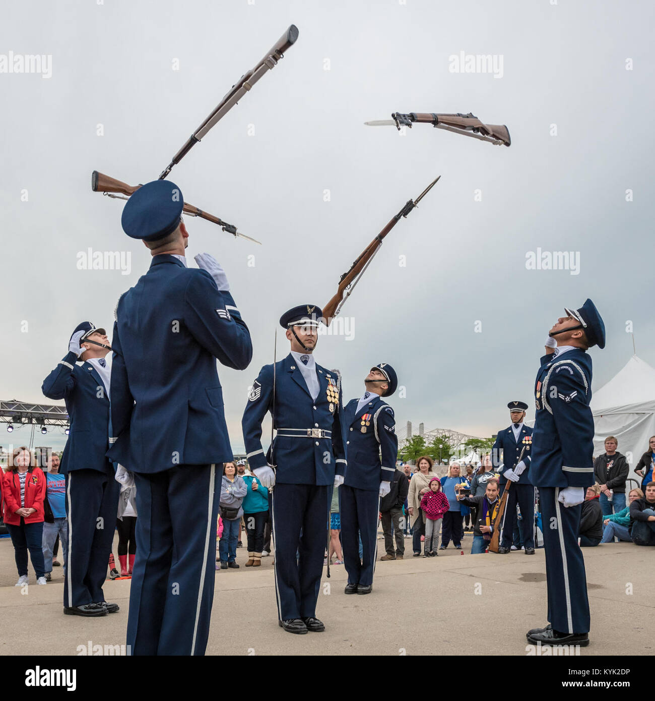 Members of the U.S. Air Force Honor Guard execute a precision rifle drill before an appreciative crowd at Waterfront Park in downtown Louisville, Ky., May 3, 2017, as part of the Kentucky Derby Festival. The Airmen, from Joint Base Anacostia-Bolling in Washington, D.C., strive to represent the Air Force Core Values of integrity, service and excellence through precise drill movements, immaculate appearance and extreme attention to detail. (U.S. Air National Guard photo by Lt. Col. Dale Greer) Stock Photo