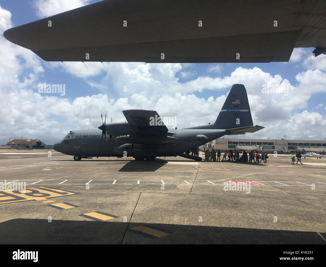 Twelve members of the Kentucky Air National Guard’s 123rd Airlift Wing and two of the unit’s C-130 aircraft helped evacuate more than 1,000 U.S. citizens from the Dutch Caribbean island of St. Maarten Sept. 9-10, 2017, flying them to safety in Puerto Rico in the wake of Hurricane Irma. The Kentucky Airmen, who personally evacuated more than 400 people, were part of a team that included aircraft and Airmen from the New York Air Guard’s 106th Rescue Wing and the Puerto Rico Air Guard’s 156th Airlift Wing. (U.S. Air National Guard photo) Stock Photo