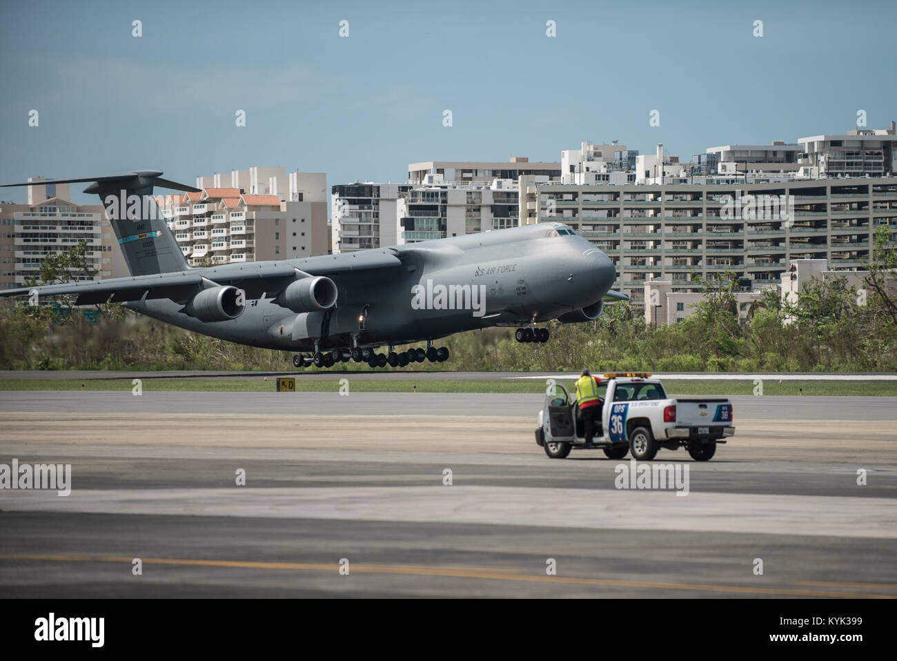 A U.S. Air Force C-5 Galaxy loaded with humanitarian aid lands at Luis Muñoz Marín International Airport in San Juan on Oct. 5, 2017. The cargo will be downloaded and staged for distribution by Airmen from the Kentucky Air Guard’s 123rd Contingency Response Group as part of Hurricane Maria recovery efforts. (U.S. Air National Guard photo by Lt. Col. Dale Greer) Stock Photo