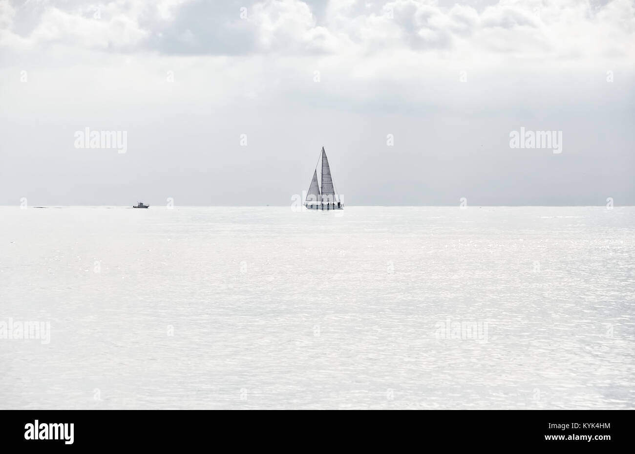 Boats on the horizon line - high key - Ligurian sea Stock Photo