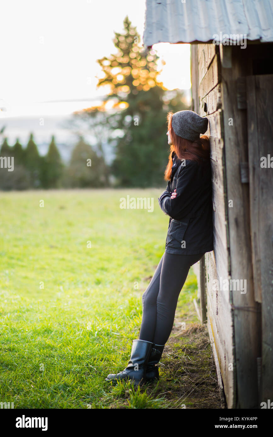 Girl With Arms Crossed Outdoors Stock Photo