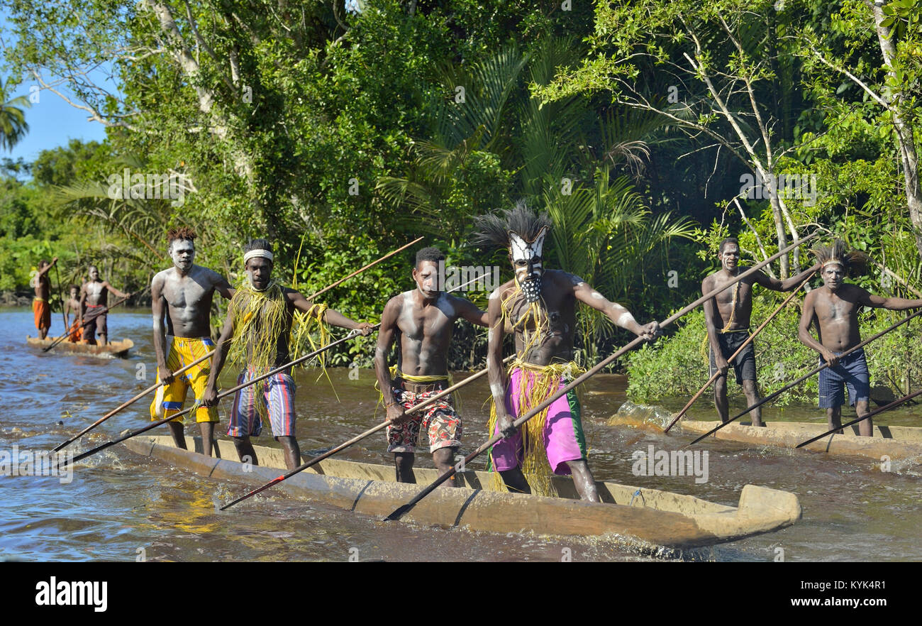 Canoe war ceremony of Asmat people. Headhunters of a tribe of Asmat . New Guinea Island, Stock Photo