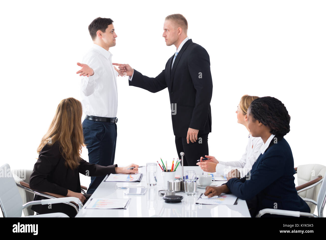 Boss Shouting On Male Executive In Business Meeting Stock Photo