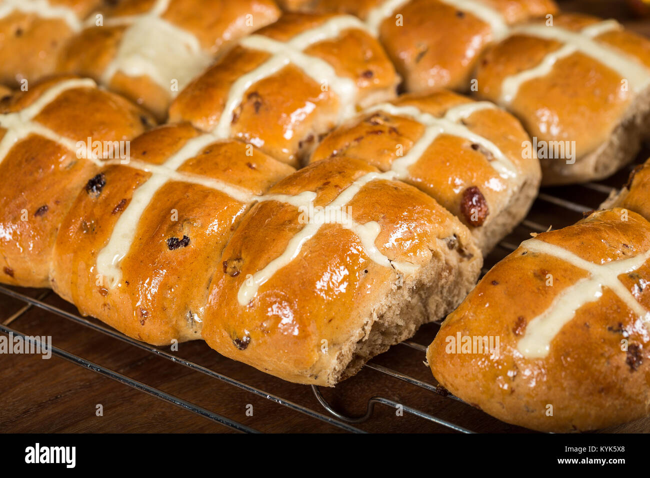 Homemade fresh from the oven Hot Cross Buns on cooling rack Stock Photo