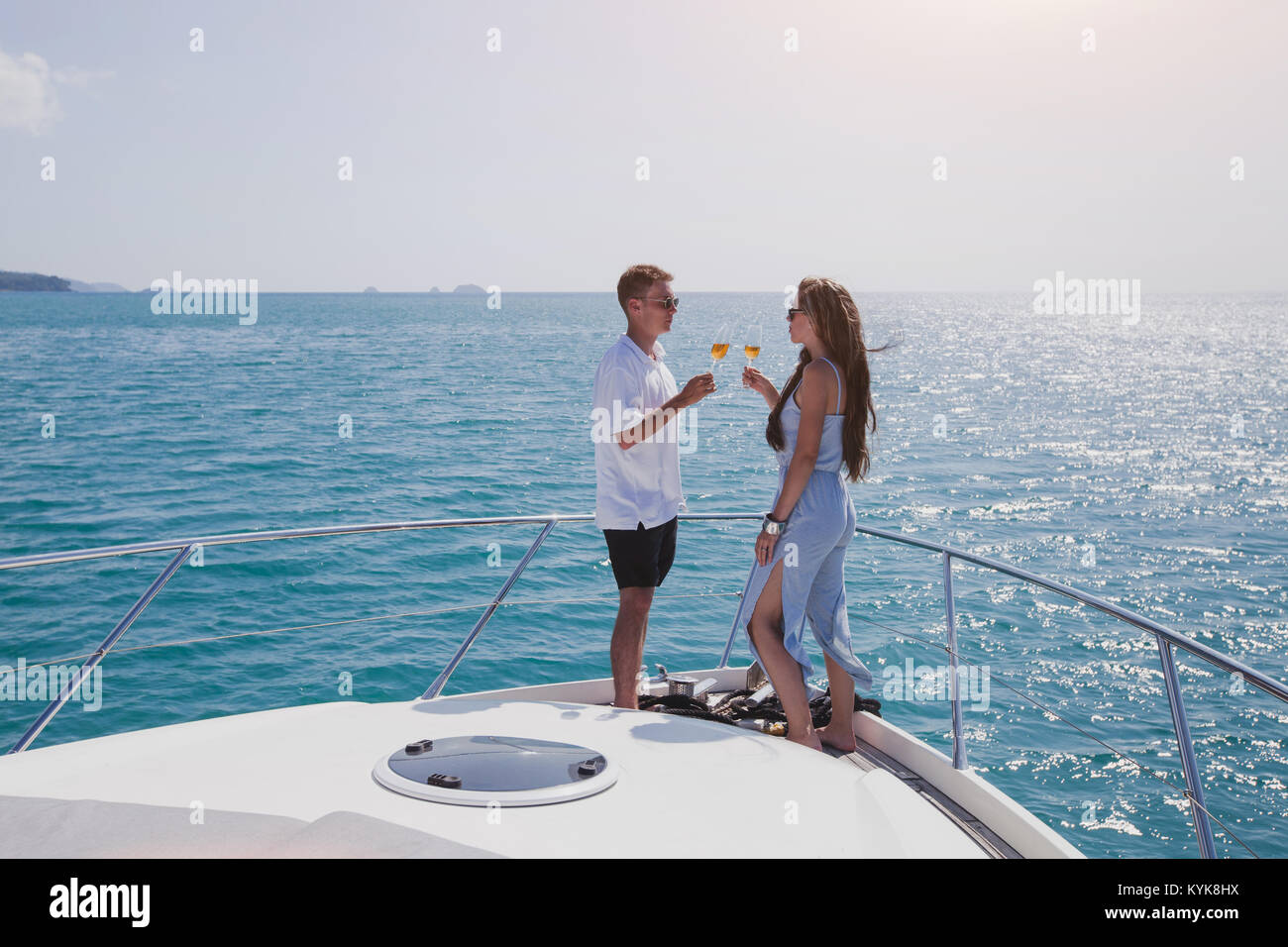 couple drinking champange on luxury yacht on cruise, luxurious lifestyle Stock Photo
