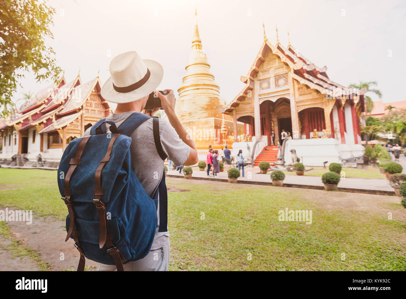 travel to Asia, tourist photographer taking photo of temple or landmark, tourism in Thailand Stock Photo