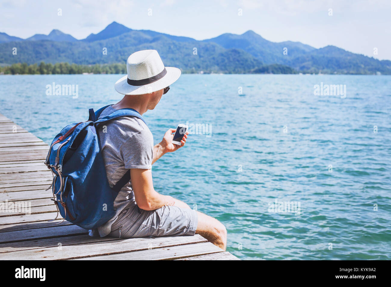 tourist traveler using mobile phone, smartphone app for traveling Stock Photo