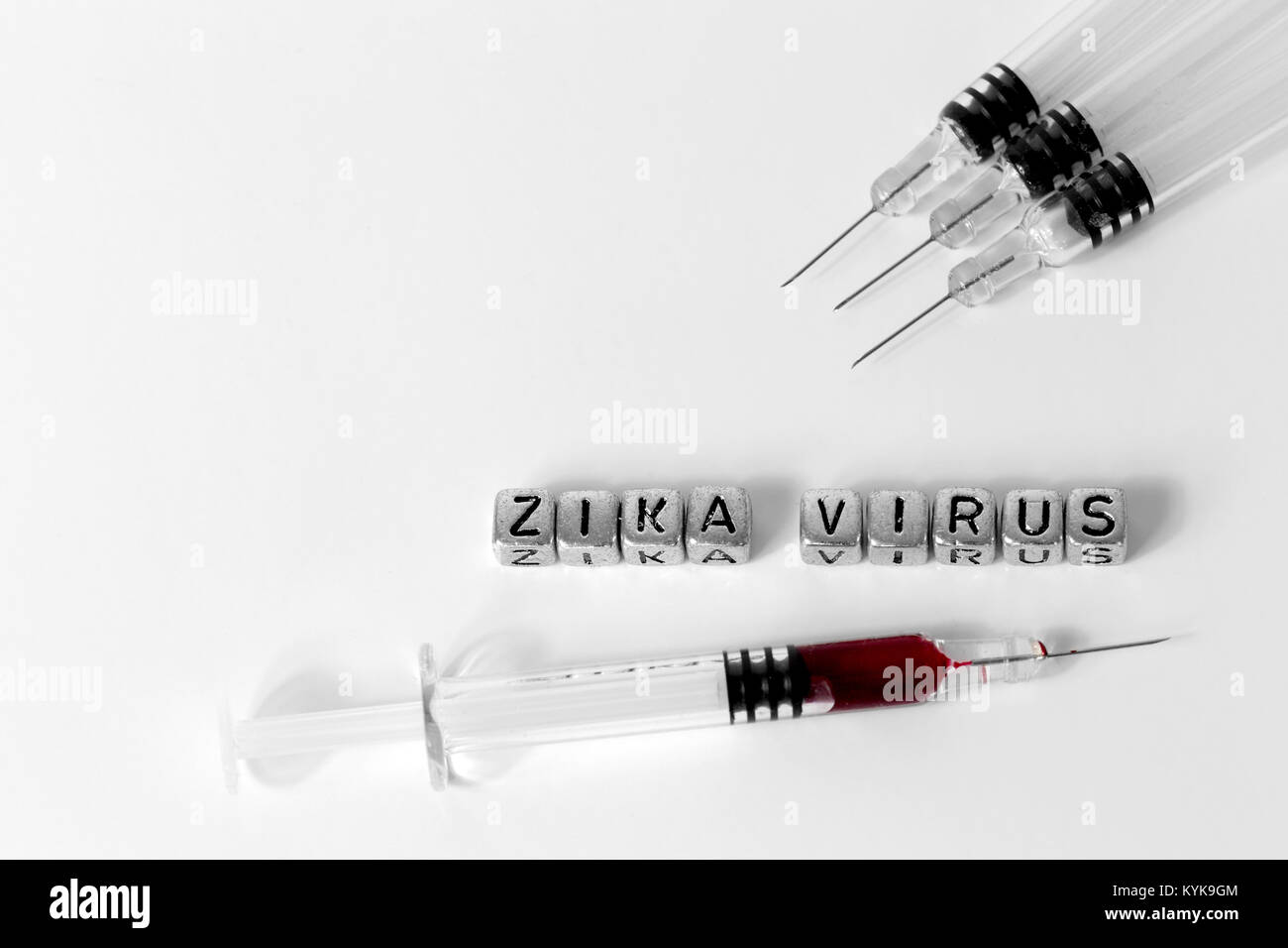 Syringes and blood with the words Zika Virus on beads Stock Photo - Alamy