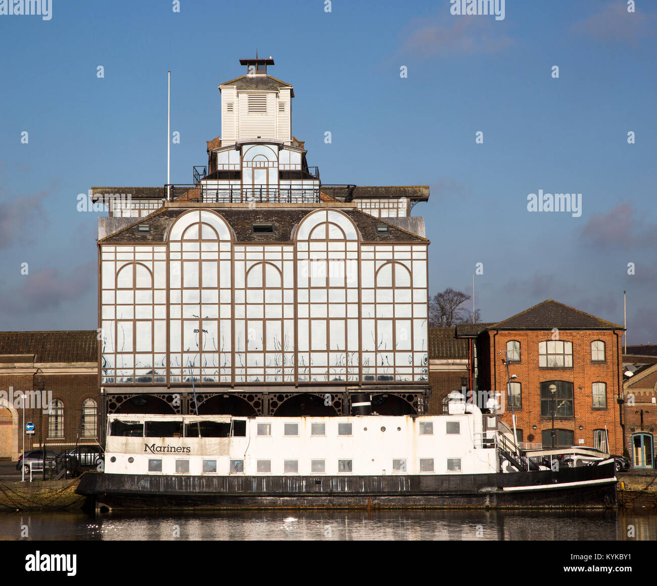Modern glass office building and Mariners floating restaurant boat