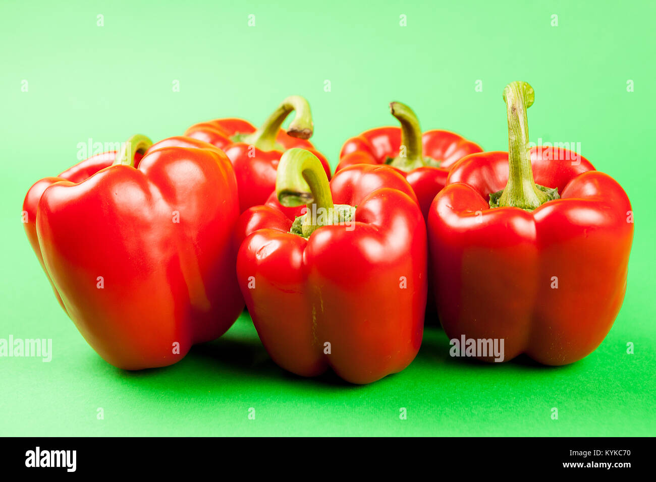 Group of five fresh and healthy sweet red peppers Stock Photo - Alamy