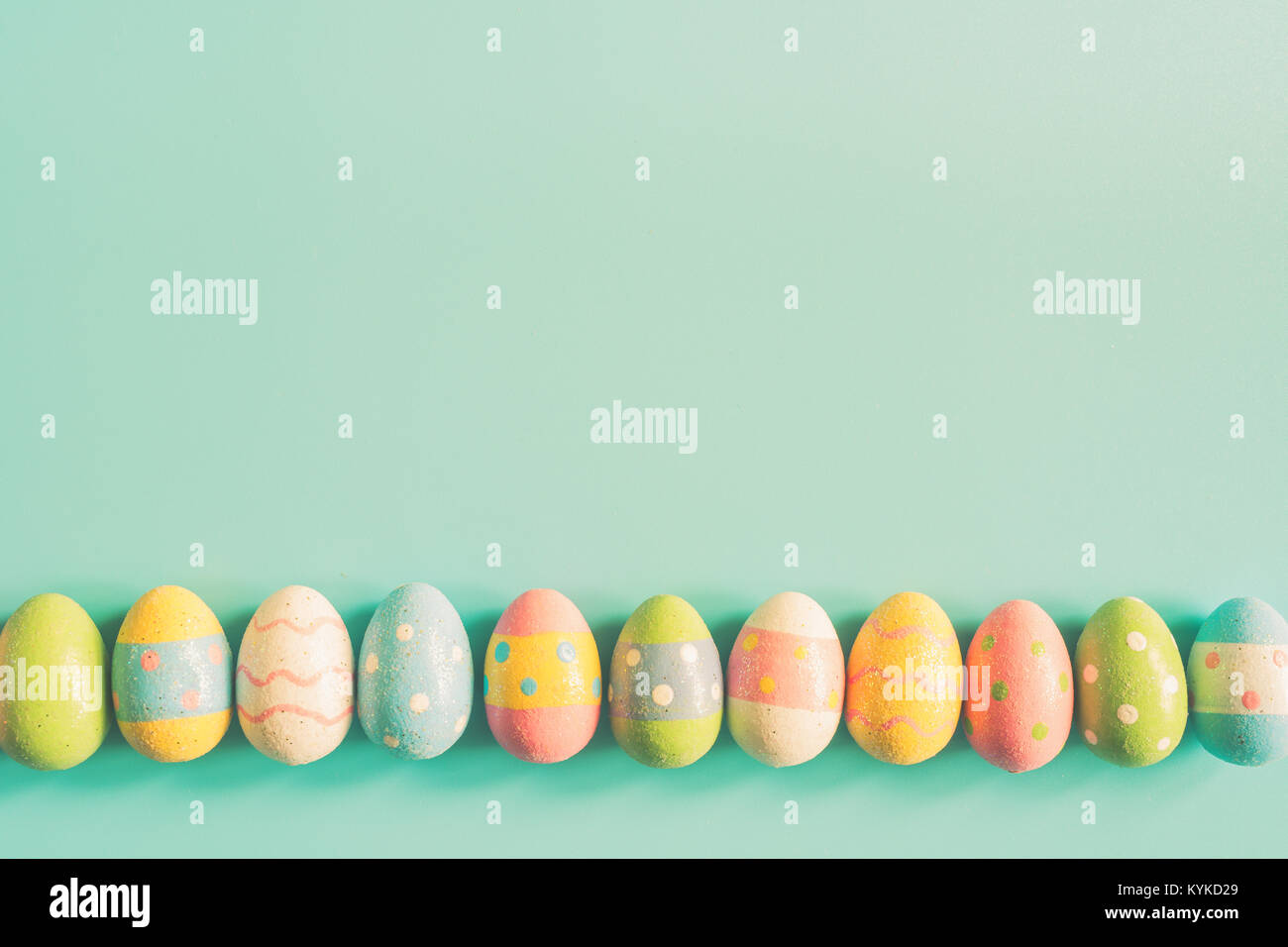 Coloeful easter eggs on pastel color background with space Stock Photo ...