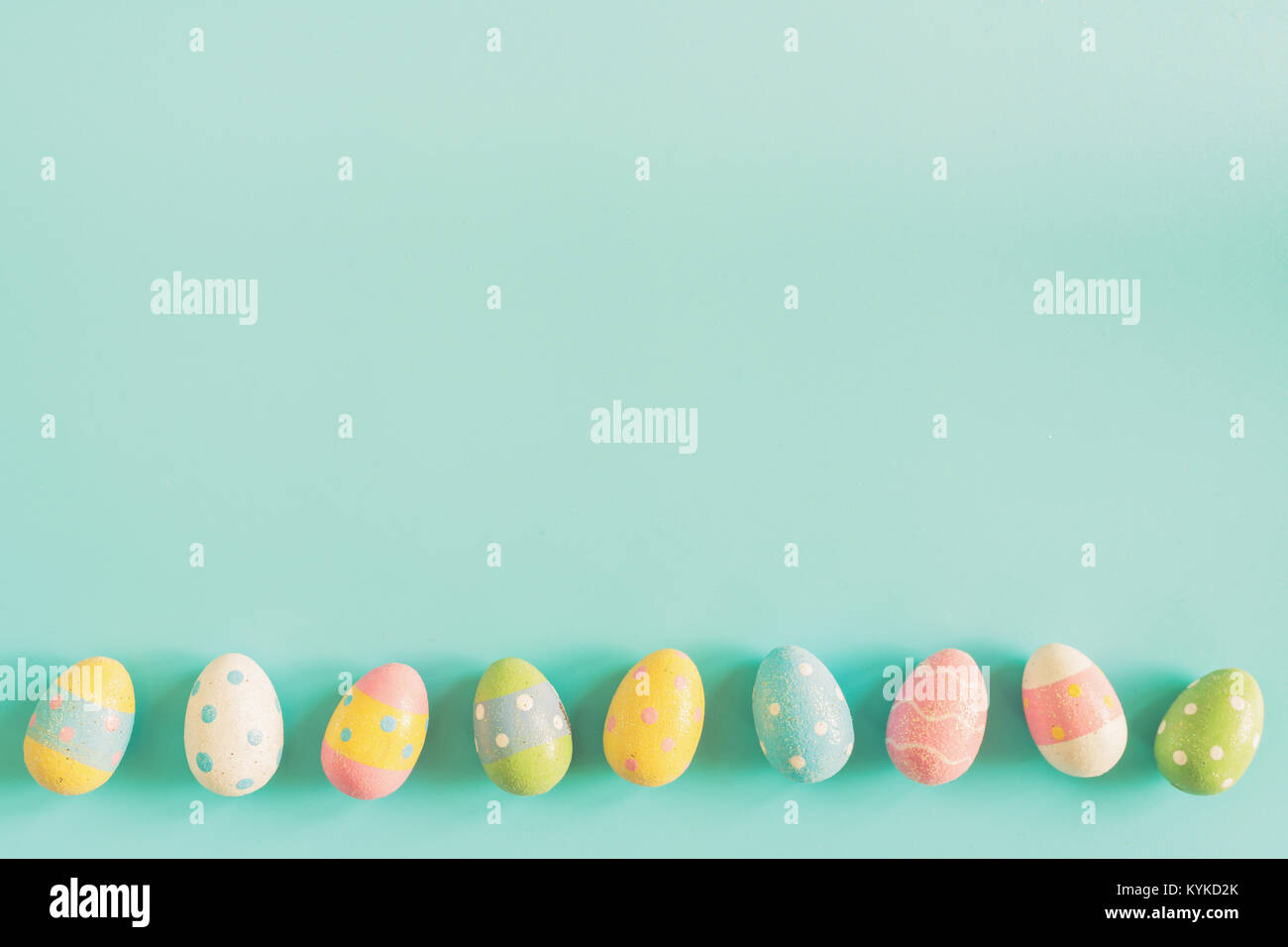 Coloeful easter eggs on pastel color background with space Stock Photo ...