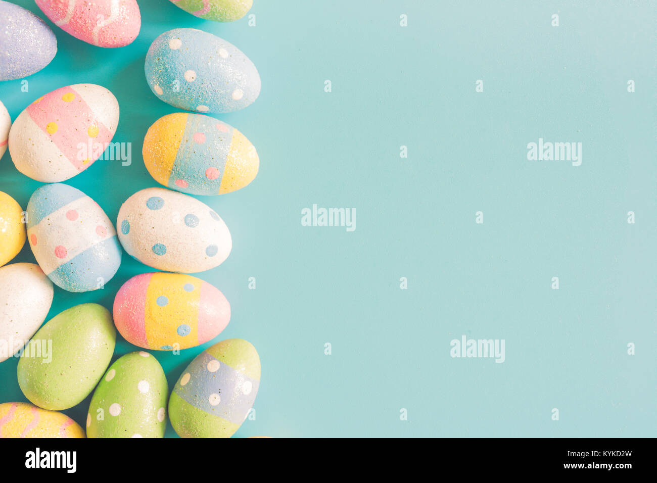 Coloeful easter eggs on pastel color background with space Stock Photo ...