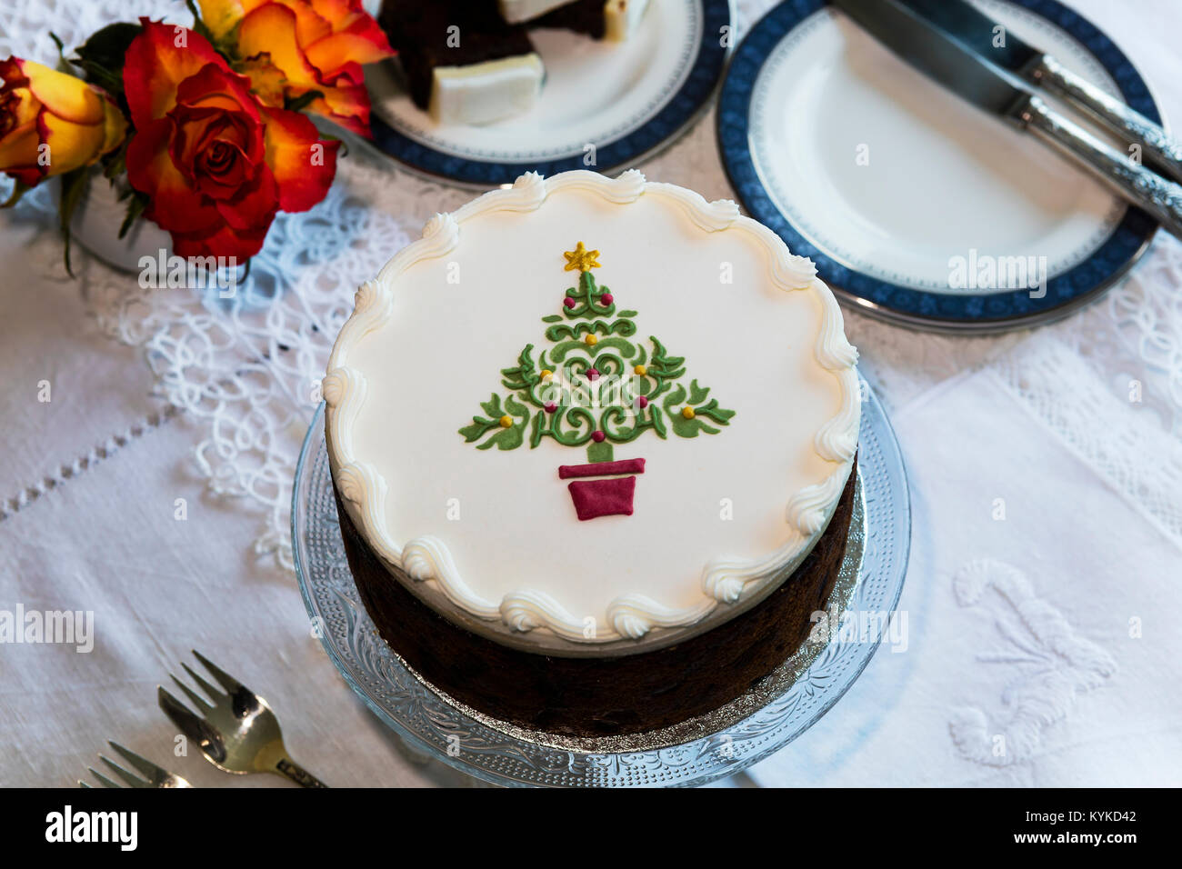 Fruit cake decorated on top with marzipan and royal icing and stencilled  Christmas Tree. Stock Photo